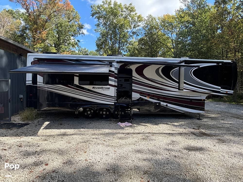 2023 Forest River RiverStone Signature 41RL - Used Fifth Wheel For Sale by Pop RVs in Clay, Michigan features Generator, Slideout, Awning, Leveling Jacks, Air Conditioning