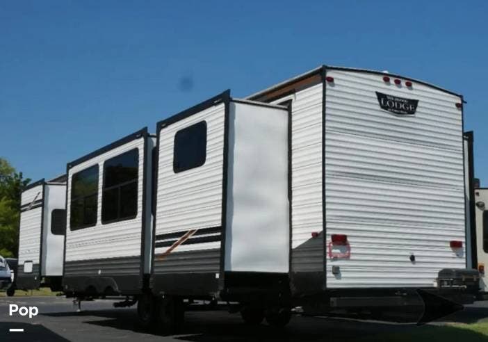 2022 Forest River Wildwood LODGE 42QBQ - Used Travel Trailer For Sale by Pop RVs in Jonesboro, Indiana features Leveling Jacks, Slideout, Air Conditioning, Awning