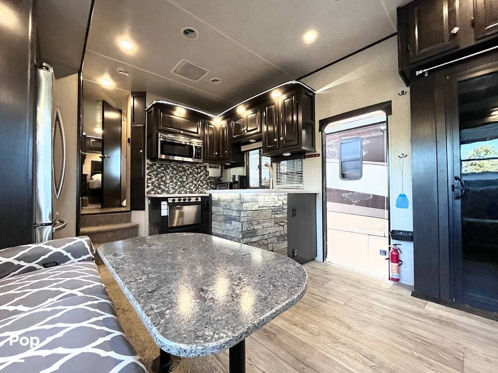 2017 Heartland Road Warrior 427 - Used Toy Hauler For Sale by Pop RVs in Panama City, Florida features Awning, Slideout, Generator, Leveling Jacks, Air Conditioning