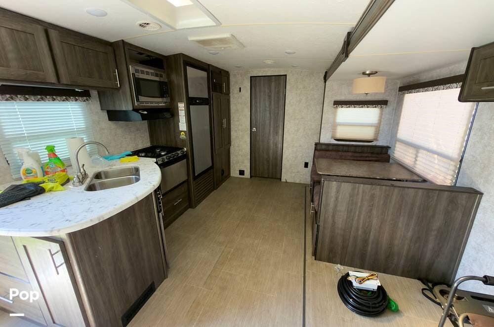 2017 Highland Ridge Open Range 2604RB - Used Travel Trailer For Sale by Pop RVs in Eagle Lake, Florida features Leveling Jacks, Awning, Slideout, Air Conditioning