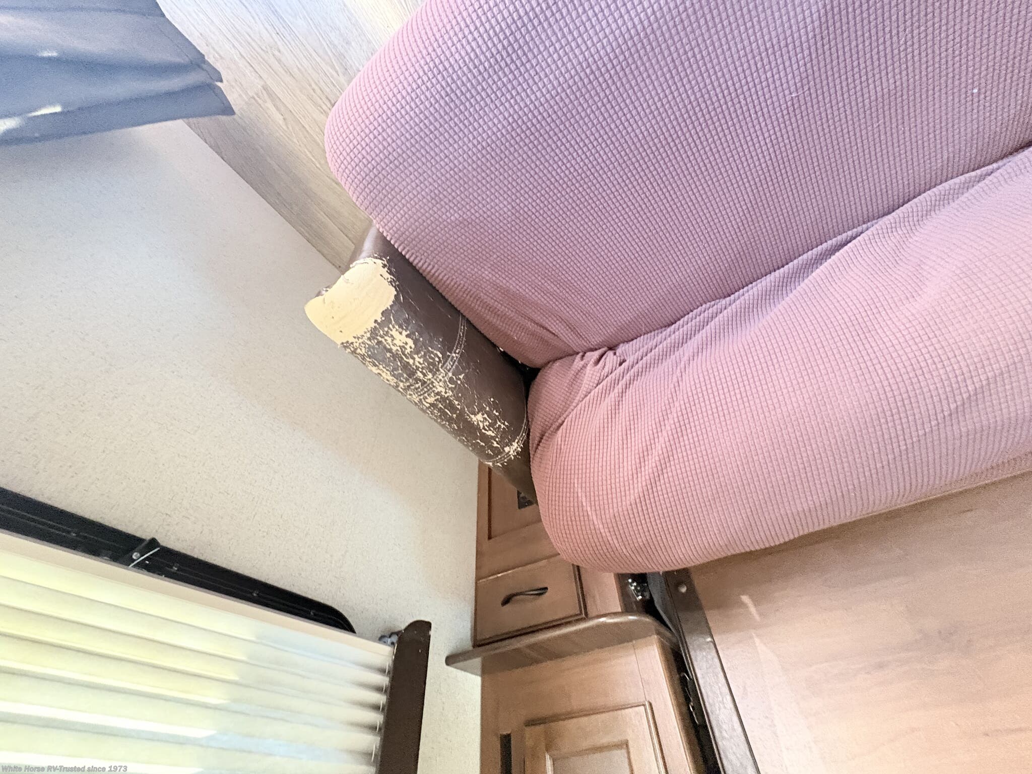 please see photos for wear on Tri-Fold Sofa * Does has a sofa cover on it , but photos do show signs of wear on the arm rest on both sides. Sold As is... 