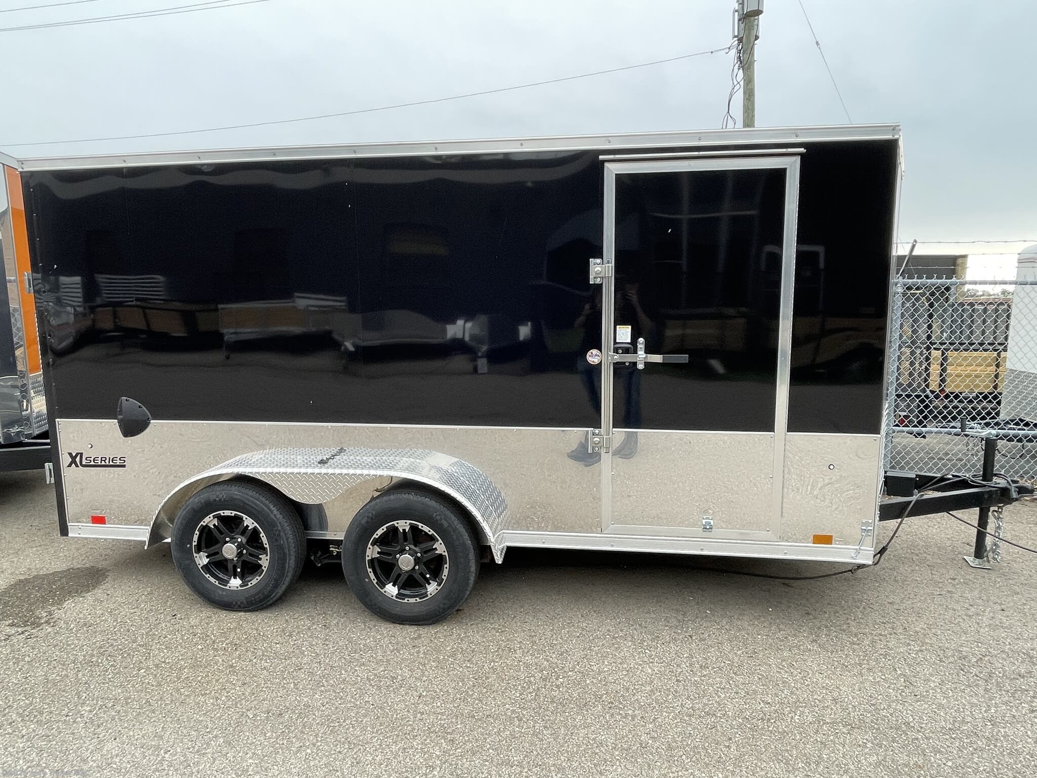 Cargo Express 7X14 Enclosed Trailer, 7x14 enclosed trailer, Cargo Express trailer, flat top enclosed trailer, 18" V nose trailer, one piece aluminum roof trailer, white aluminum roof trailer, 2x4 tube frame trailer, 3.5K spring axles trailer, 16" O/C sidewalls trailer, 32x74 side door trailer, high perforated floor trailer, high perforated walls trailer, folding stabilizer jack trailer, 15" radial tires trailer, black aluminum rims trailer, enclosed cargo trailer, enclosed utility trailer, aluminum enclosed trailer, V-nose cargo trailer, radial tires trailer, black rims trailer, high perforated floor, high perforated walls, tube frame trailer, spring axle trailer, side door trailer, stabilizer jack trailer, radial tire trailer, aluminum rim trailer, white enclosed trailer, 7x14 cargo trailer, 7x14 trailer, Cargo Express 7x14, enclosed trailer with V nose, aluminum roof enclosed trailer, perforated floor trailer, perforated walls trailer, stabilizer jack, enclosed trailer with radial ti