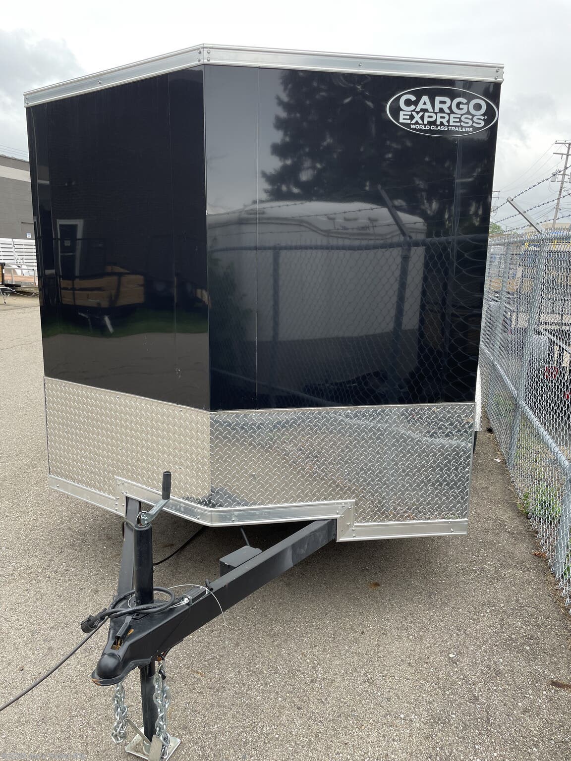 Cargo Express 7X14 Enclosed Trailer, 7x14 enclosed trailer, Cargo Express trailer, flat top enclosed trailer, 18" V nose trailer, one piece aluminum roof trailer, white aluminum roof trailer, 2x4 tube frame trailer, 3.5K spring axles trailer, 16" O/C sidewalls trailer, 32x74 side door trailer, high perforated floor trailer, high perforated walls trailer, folding stabilizer jack trailer, 15" radial tires trailer, black aluminum rims trailer, enclosed cargo trailer, enclosed utility trailer, aluminum enclosed trailer, V-nose cargo trailer, radial tires trailer, black rims trailer, high perforated floor, high perforated walls, tube frame trailer, spring axle trailer, side door trailer, stabilizer jack trailer, radial tire trailer, aluminum rim trailer, white enclosed trailer, 7x14 cargo trailer, 7x14 trailer, Cargo Express 7x14, enclosed trailer with V nose, aluminum roof enclosed trailer, perforated floor trailer, perforated walls trailer, stabilizer jack, enclosed trailer with radial ti