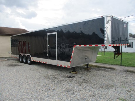 &lt;p&gt;**ONE OWNER** TRI-AXLE CAR HAULER. 7,000 LB AXLES. BUILT-IN WORKSPACE WITH LOWER CABINETS. (2) MANUAL ROOF VENTS&amp;nbsp; POWER FRONT LEVELING JACKS.&amp;nbsp; MOUNTED INTERIOR D-RINGS. REAR SPRING ASSISTED RAMP DOOR. 36&quot; SIDE ENTRY DOOR.&amp;nbsp;&lt;/p&gt;
&lt;p&gt;LOWER FLOOR DIMENSIONS: 27&#39; LONG X 8&#39; WIDE (6&#39; 11&quot; BETWEEN WHEEL WELLS)&lt;/p&gt;
&lt;p&gt;INTERIOR HEIGHT: 6&#39; 10&quot;&lt;/p&gt;
&lt;p&gt;GROUND TO GOOSE NECK COUPLER: 43&quot;&lt;/p&gt;
&lt;p&gt;&amp;nbsp;&lt;/p&gt;
&lt;p&gt;&amp;nbsp;&lt;/p&gt;
&lt;p&gt;&amp;nbsp;&lt;/p&gt;