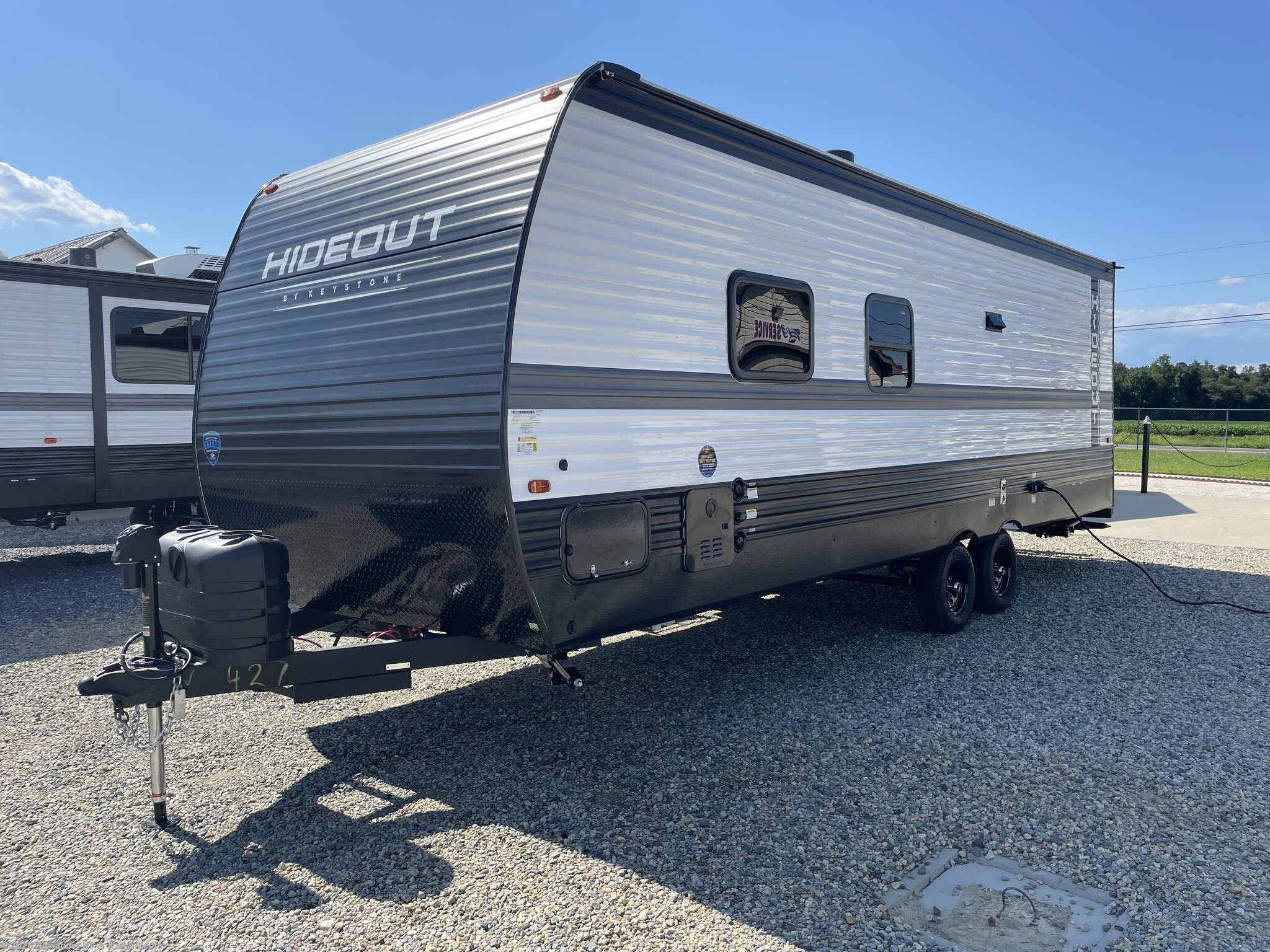2025 Keystone Hideout Sport East 240BH - New Travel Trailer For Sale by Alexander RV & Trailer Center in Clayton, Delaware features Stabilizer Jacks, Booth Dinette, Power Roof Vent, Tankless Demand Gas Water Heater, Converter