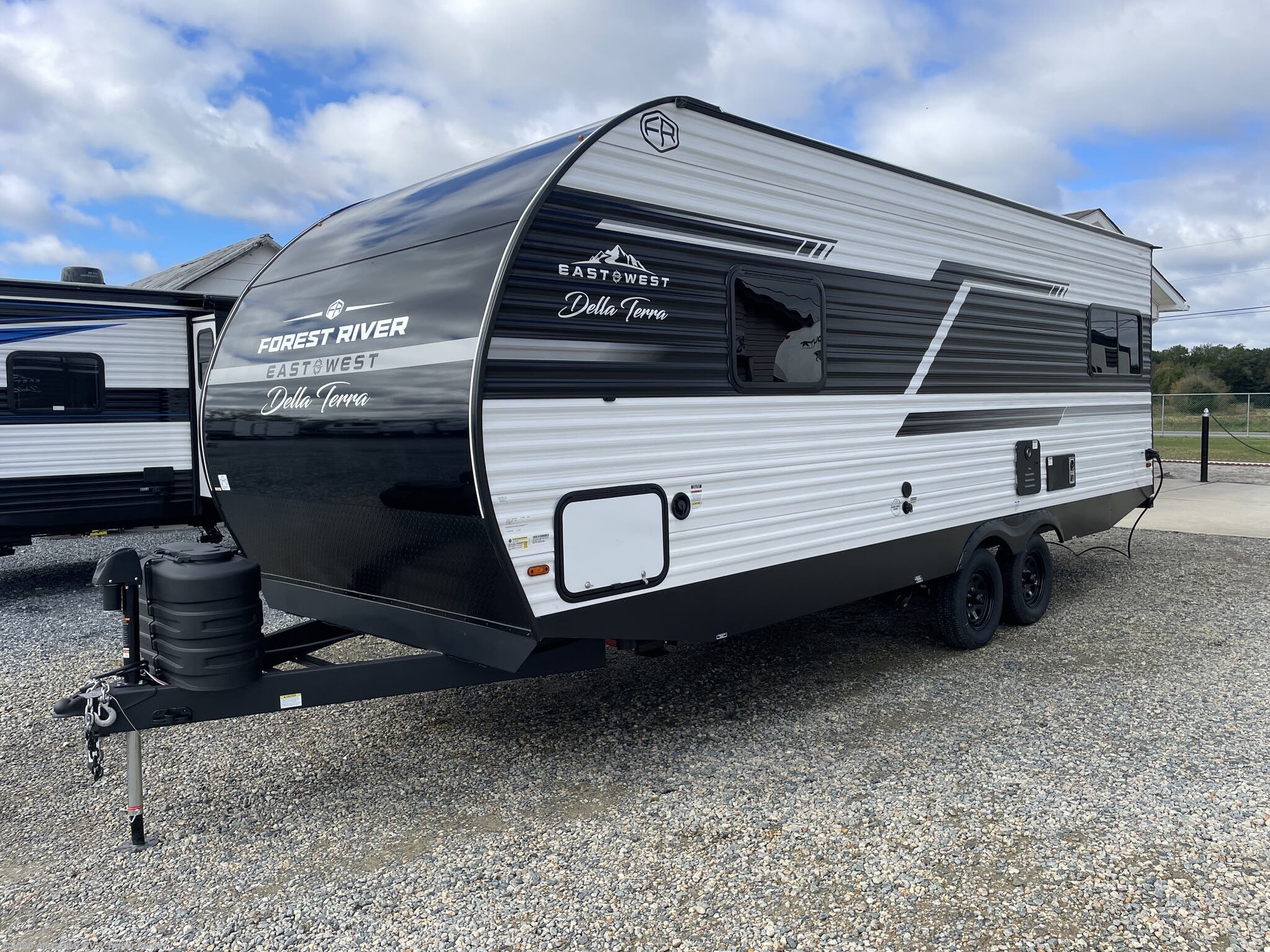 2026 East to West Della Terra 200RD - New Travel Trailer For Sale by Alexander RV & Trailer Center in Clayton, Delaware features Spare Tire Kit, Pass Thru Storage, Diamond Shield Paint Protection Film, Air Conditioning, Power Stabilizer Jacks