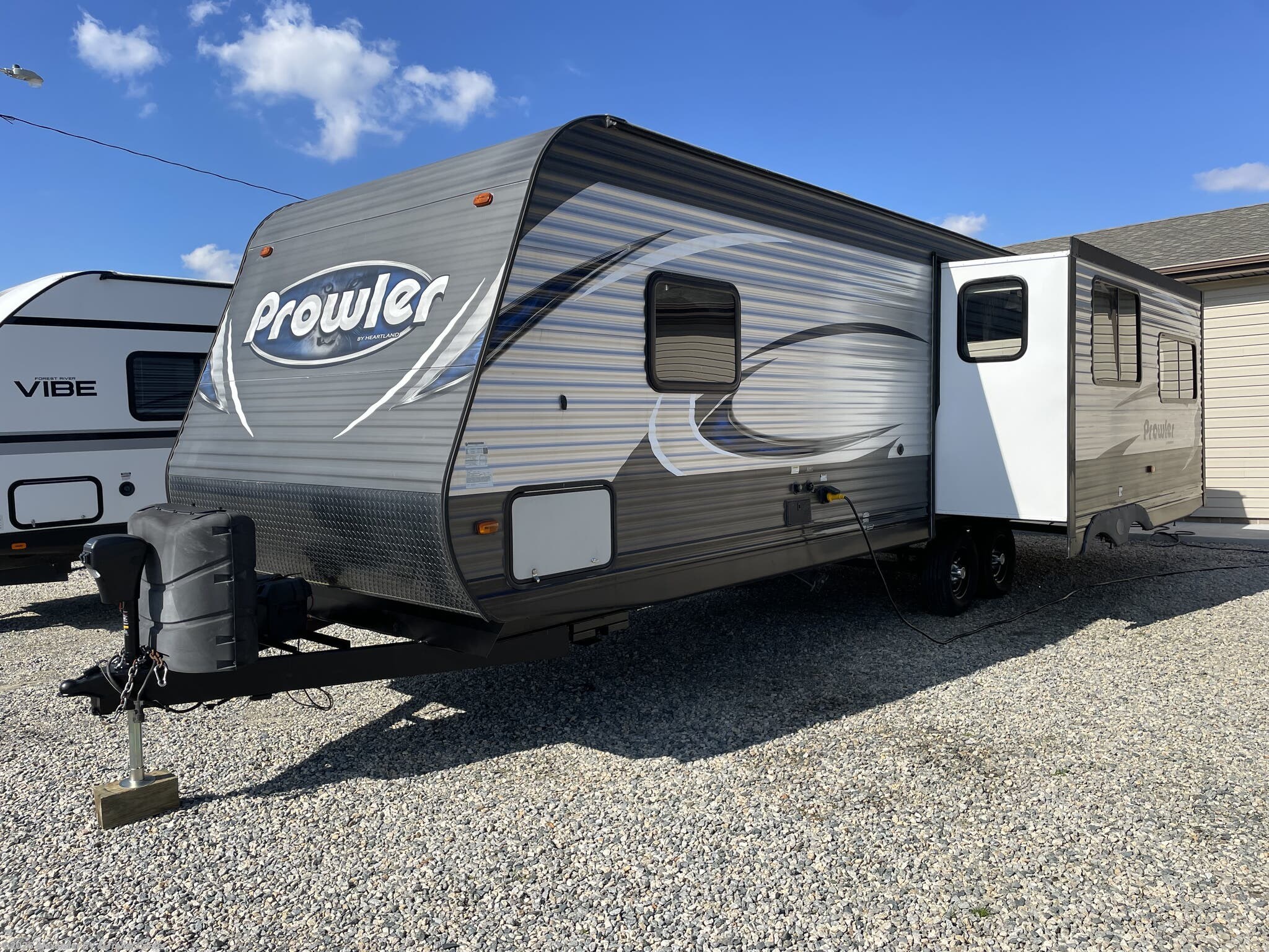 2017 Heartland Prowler 28RLS - Used Travel Trailer For Sale by Alexander RV & Trailer Center in Clayton, Delaware features Water Heater, Queen Bed, LP Detector, Enclosed Underbelly, Slideout