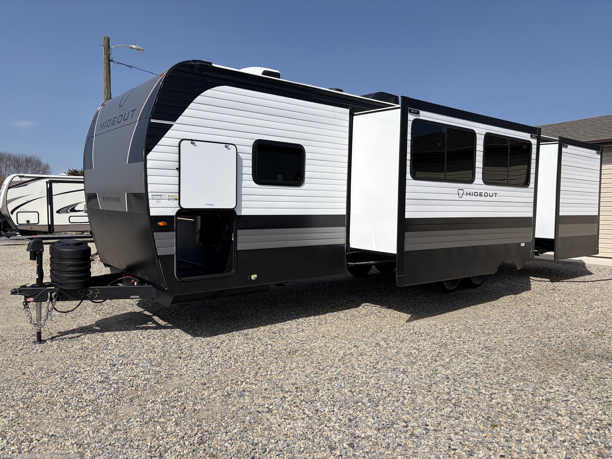 2026 Keystone Hideout 310XBR - New Travel Trailer For Sale by Alexander RV & Trailer Center in Clayton, Delaware features Heated Underbelly, Toilet, Convection Microwave, Diamond Shield Paint Protection Film, Slam Latch Baggage Doors