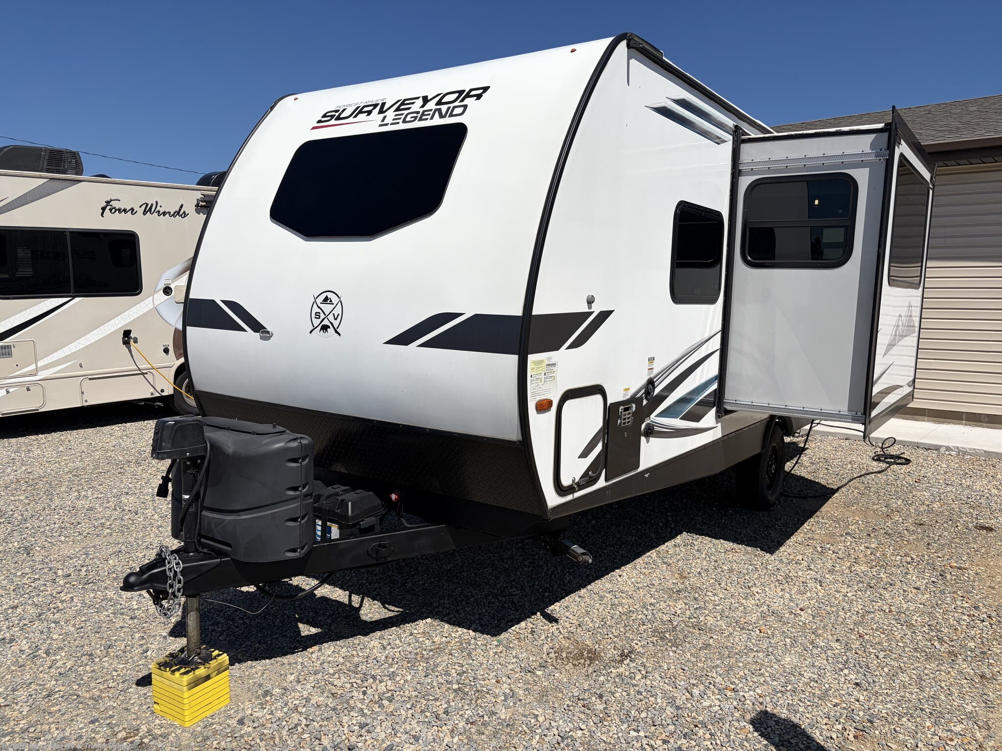 2022 Forest River Surveyor Legend 19RBLE - Used Travel Trailer For Sale by Alexander RV & Trailer Center in Clayton, Delaware features 30 Amp Service, Toilet, Aluminum Entrance Steps, Pass Thru Storage, Fiberglass Sidewalls