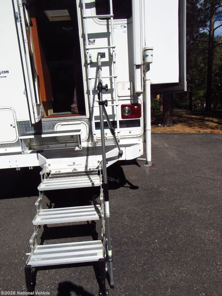 2015 Arctic Fox Truck Camper 811 by Northwood from National Vehicle in Larkspur, Colorado