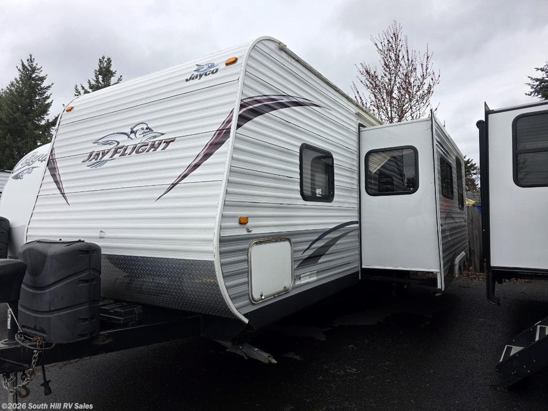 2012 Jayco Jay Flight 25BHS - Used Travel Trailer For Sale by South Hill RV Sales in Yelm, Washington features Air Conditioning, Leveling Jacks, Non-Smoking Unit, Toilet, Skylight