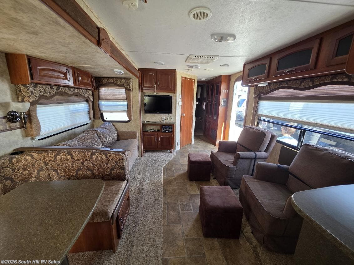 2012 Keystone Cougar 30RKS - Used Travel Trailer For Sale by South Hill RV Sales in Yelm, Washington features Power Awning, External Shower, Leveling Jacks, Auxiliary Battery, Medicine Cabinet