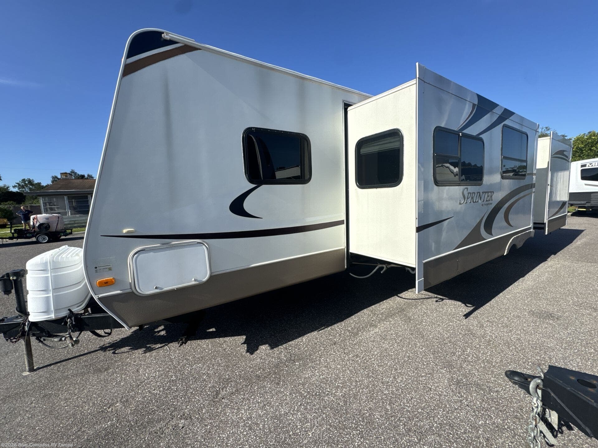 2009 Sprinter 311BHS by Keystone from Blue Compass RV Tampa in Dover, Florida