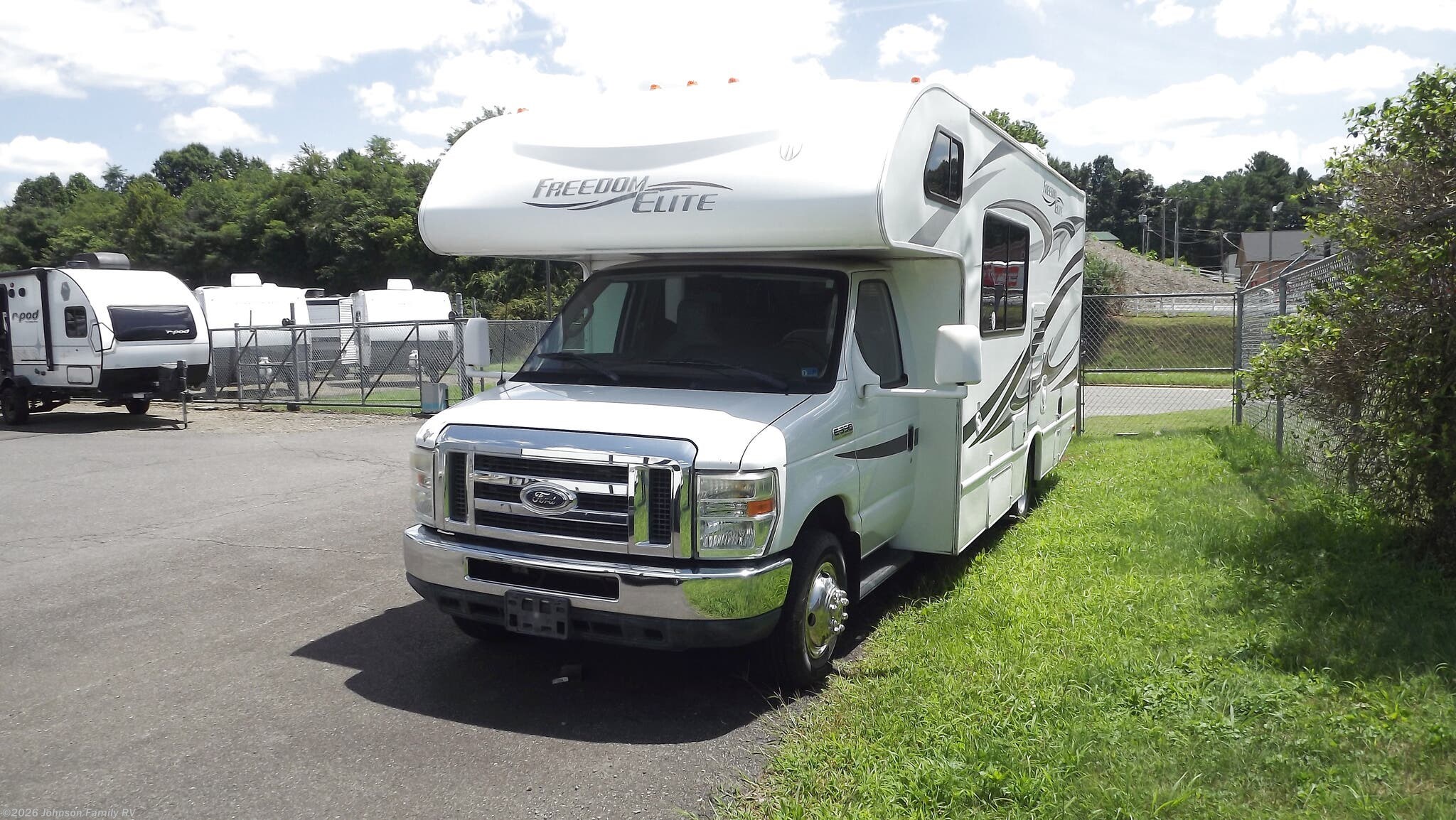 2012 Keystone Freedom Elite 23U - Used Class C For Sale by Johnson Family RV in Woodlawn, Virginia features Awning, Microwave, Ladder, Stereo System, Shower