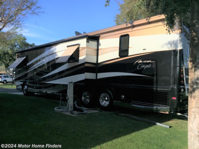2013 American Coach American Eagle 45T - Used Diesel Pusher For Sale by Motor Home Finders in Las Vegas, Nevada features Leveling Jacks, Front Overhead Storage, Power Seats, Security System, External Shower