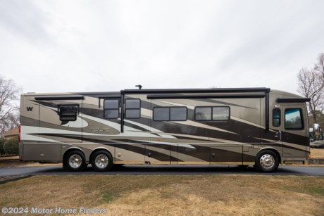 &lt;p class=&quot;MsoNormal&quot;&gt;&lt;span style=&quot;mso-bidi-font-family: Calibri; mso-bidi-theme-font: minor-latin; color: black; background: white;&quot;&gt;This 2013 Winnebago Tour 42GD, Tag Axle, Quad Slide, Class A, All Electric Motorhome Is Powered by a Cummins 450HP ISL 8.9L Turbo Charged Diesel, Rides on a Maxum Freightliner Chassis with Independent Front and Rear Air Suspension, Has &lt;/span&gt;&lt;span style=&quot;mso-bidi-font-family: Calibri; mso-bidi-theme-font: minor-latin;&quot;&gt;Automatic Leveling Jacks W/3-Position Controls, i&lt;span style=&quot;color: black; background: white;&quot;&gt;s Mated to an Allison MH 3000 6 Speed Auto Transmission and has a 15,000 Lb. Trailer Hitch.&lt;/span&gt;&lt;/span&gt;&lt;/p&gt;
&lt;p class=&quot;MsoNormal&quot;&gt;&lt;span style=&quot;mso-bidi-font-family: Calibri; mso-bidi-theme-font: minor-latin; color: black; background: white;&quot;&gt;This Coach Comes with Polished Pewter FBP, the Apollo Interior, Coffee Glazed Honey Cherry Cabinetry, &lt;/span&gt;Polished Stainless Steel on Lower Valance Doors/Panels a&lt;span style=&quot;mso-bidi-font-family: Calibri; mso-bidi-theme-font: minor-latin; color: black; background: white;&quot;&gt;nd &lt;/span&gt;Stylized Aluminum Wheels.&lt;/p&gt;
&lt;p class=&quot;MsoNormal&quot;&gt;The Entry Way has Power Door Locks W/Remote Keyless Entry, Automatic Entrance Steps, Powered Stepwell Cover, Flexsteel&amp;reg; Luxury Driver And Queen Passenger Seat w/Six-Way Power, Power Passenger Footrest, Heat and Massage, Remote Swivel, Power Lumbar Support, Manual Recline, Adjustable Armrests, Tilt/Telescoping Smart Steering Wheel, Infotainment Center/GPS Voice Navigation, 7&quot; LCD Touch Screen Color Monitor W/PIP, Compass, Outside Temperature, Handheld Remote and Steering Wheel Remote, AM/FM/CD/DVD Radio, Bluetooth,&amp;trade; Sirius&amp;reg; Satellite Ready, iPod Interface Connector, Passenger Side Monitor, Rear and Sideview Cameras, Electric Adjustable Mirrors W/Defrost, Sideview Camera and Turn Signal Light In Lower Glass, and MCD American Duo&amp;reg; Solar/Blackout Roller Shades (Powered For Windshield and Manual For Driver/Passenger Windows).&lt;/p&gt;
&lt;p class=&quot;MsoNormal&quot;&gt;The Interior Starts with a Soft Vinyl Ceiling, Accent Lights above Front Overhead Cabinets and Ceiling Trim Panels, A Lounge Chair/Recliner W/Cabinet and Pull-Out Table, An Ultraleather Rest Easy Extendable Sectional Sofa W/Ottomans, an Extendable Dining Table and Chairs, a Buffett and MCD American Duo Solar/Blackout Roller Shades.&lt;/p&gt;
&lt;p class=&quot;MsoNormal&quot;&gt;The Forward Galley Has Corian&amp;reg; Countertops, Backsplash and Sink Covers, a Stainless-Steel Refrigerator W/French Doors Freezer Drawer, Water and Ice Dispenser, a Stainless-Steel Drawer-Style Dishwasher, a Stainless-Steel Convection&lt;span style=&quot;color: red;&quot;&gt; &lt;/span&gt;Microwave/Speedcook Oven w/Exterior Vented Range Fan, a 2-Burner Induction Range Top W/Storage Below and a Dirt Devil&amp;reg; Central Vacuum System w/Vac Pan.&lt;/p&gt;
&lt;p class=&quot;MsoNormal&quot;&gt;A/V Systems Include a 40&quot; LCD TV (Front Overhead), a New 58&quot; LED SMART TV (Mid-Coach), a 32&quot; LCD TV (Bedroom), an Exterior Entertainment Center(32&quot; LCD TV/Stereo w/Remote), a Blu-Ray&amp;reg; Home Theater Sound System CD/DVD Player, iPhone&amp;reg;/iPod Dock w/Video, Receiver, Amplifier, 5 Speakers and Subwoofer, a King-Dome&amp;reg; In-Motion Satellite Dish, a Digital HDTV Amplified Antenna, and an HDMI 4x4 Matrix Central Video Selection System.&lt;/p&gt;
&lt;p class=&quot;MsoNormal&quot;&gt;The Bathroom Has Corian Countertops, a Large Shower With/Textured Glass Shower Door w/Skylight and a Powered Roof Vent, a Single Sink Vanity, a Porcelain Toilet and The Stackable Washer/Dryer.&lt;/p&gt;
&lt;p class=&quot;MsoNormal&quot;&gt;There Is Also a Full Coach Water Filtration System.&lt;/p&gt;
&lt;p class=&quot;MsoNormal&quot;&gt;The Bedroom Has a Powered King Bed W/Ideal Rest&amp;reg; Natural Reserve Digital Comfort Control Mattress and Remote Controls, Porcelain Tile Flooring, a Ceiling Fan, the TV, (2) Nightstands, a Chest Of Drawers and a Full Size Wardrobe.&lt;/p&gt;
&lt;p class=&quot;MsoNormal&quot;&gt;Heating and Cooling is provided by (3) Trueair&amp;reg; Maximum Comfort 13,500 BTU Roof Air Conditioners W/Two Heat Pumps and Three Condensation Pumps and an Aqua-Hot&amp;reg; 450 Hydronic Triple-Zone Heating System W/Continuous Hot Water.&lt;/p&gt;
&lt;p class=&quot;MsoNormal&quot;&gt;Power is thanks to a 50 Amp Powerline&amp;reg; Energy Management System w/Power Cord Reel, a 2,800-Watt Inverter/Charger w/Remote Panel, a 10,000-Watt Cummins Onan&amp;reg; Quiet Diesel&amp;trade; Auto Start Generator w/Automatic Changeover Switch W/Surge Guard&amp;reg; Plus (On Powered Slideout), (6) AGM Batteries and the Optional 100-Watt Solar Panel Battery Charger.&lt;/p&gt;
&lt;p class=&quot;MsoNormal&quot;&gt;Exterior Features Include Porch and Stepwell Lights, Powered Acrylic Entrance/Patio Awnings W/Wind Sensors, Acrylic Window Awnings, a 90&quot; X 54&quot; Slideout Storage Compartment Tray (Extends Out Either Side of The Coach), a Bodega Portable Refrigerator/Freezer on Slideout Tray, Lighted Storage Compartments W/ Keyone&amp;trade; Lock System, Heated Holding-Tank Compartments, Tinted, Dual-Glazed, Thermo-Insulated Coach Windows, and a Rear Ladder.&lt;/p&gt;
&lt;p class=&quot;MsoNormal&quot;&gt;This Is a Very Well Maintained and Serviced Coach (With AC Compressor and Serpentine Belts In 2023) And Tires That Have Less Than 12,000 Miles On Them.&lt;span style=&quot;mso-spacerun: yes;&quot;&gt;&amp;nbsp; &lt;/span&gt;Come And See Her &amp;ndash; You Won&amp;rsquo;t Be Disappointed and You Will Want to Take Her Home With You.&lt;/p&gt;