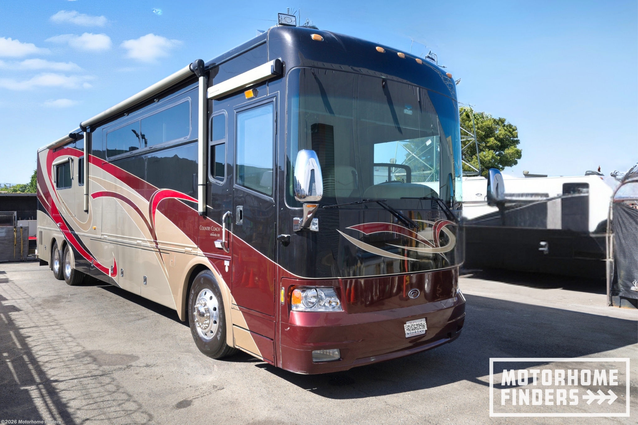 2009 Country Coach Veranda 300 - Used Diesel Pusher For Sale by Motorhome Finders in San Mateo, California features LP Detector, Self Contained, Air Assist Suspension, Backup Monitor, Fire Extinguisher
