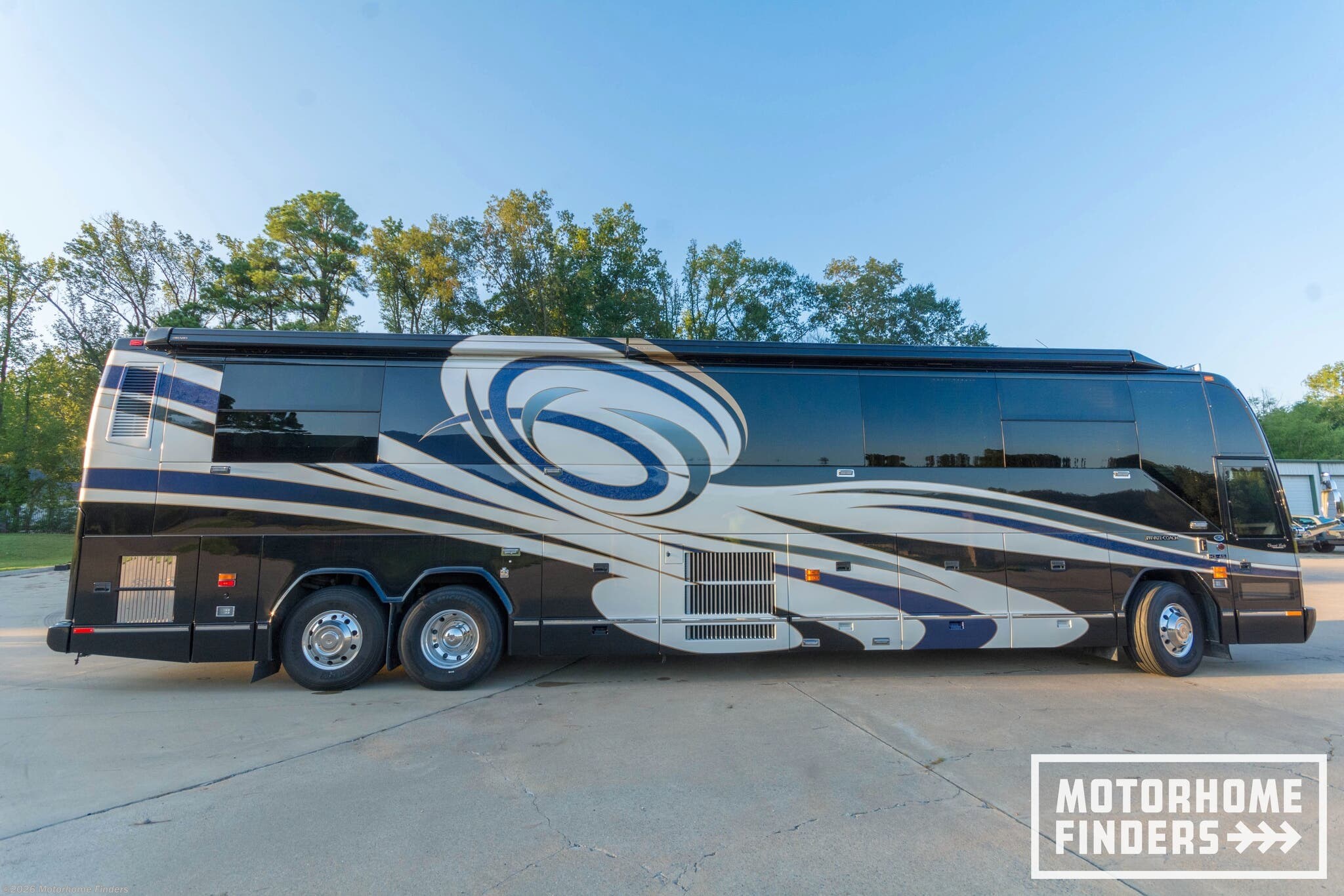 2007 Liberty Coach Elegant Lady Platinum Edition, Double Slide - Used Bus Conversion For Sale by Motorhome Finders in Bryant, Arkansas features CO Detector, Solid Surface Countertops, Outside Entertainment Center, Toilet, Alloy Wheels