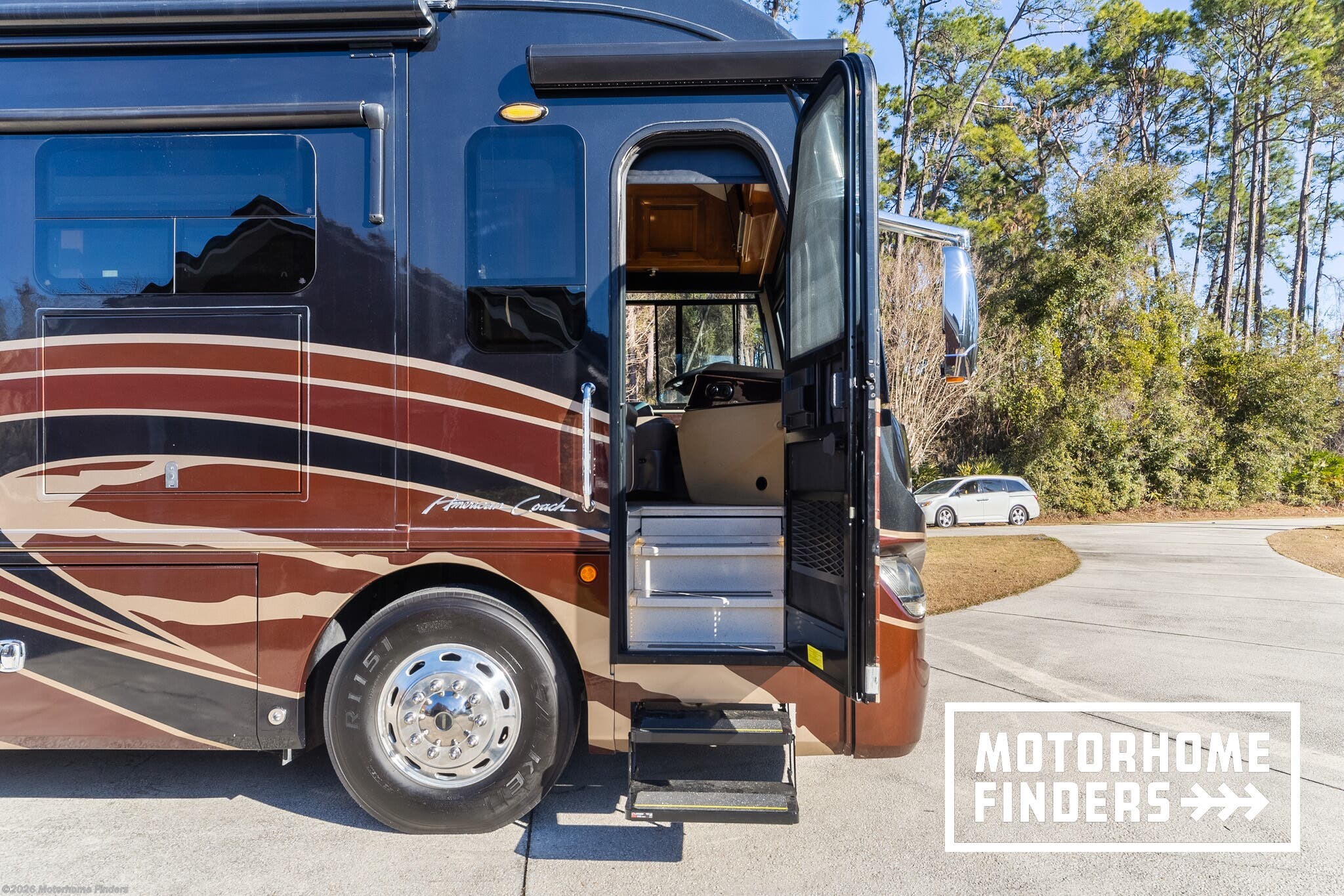 2017 American Coach American Revolution 42Q - Used Diesel Pusher For Sale by Motorhome Finders in East Palatka, Florida features Smoke Detector, Heat Pump, Washer, Alloy Wheels, Bath & 1/2