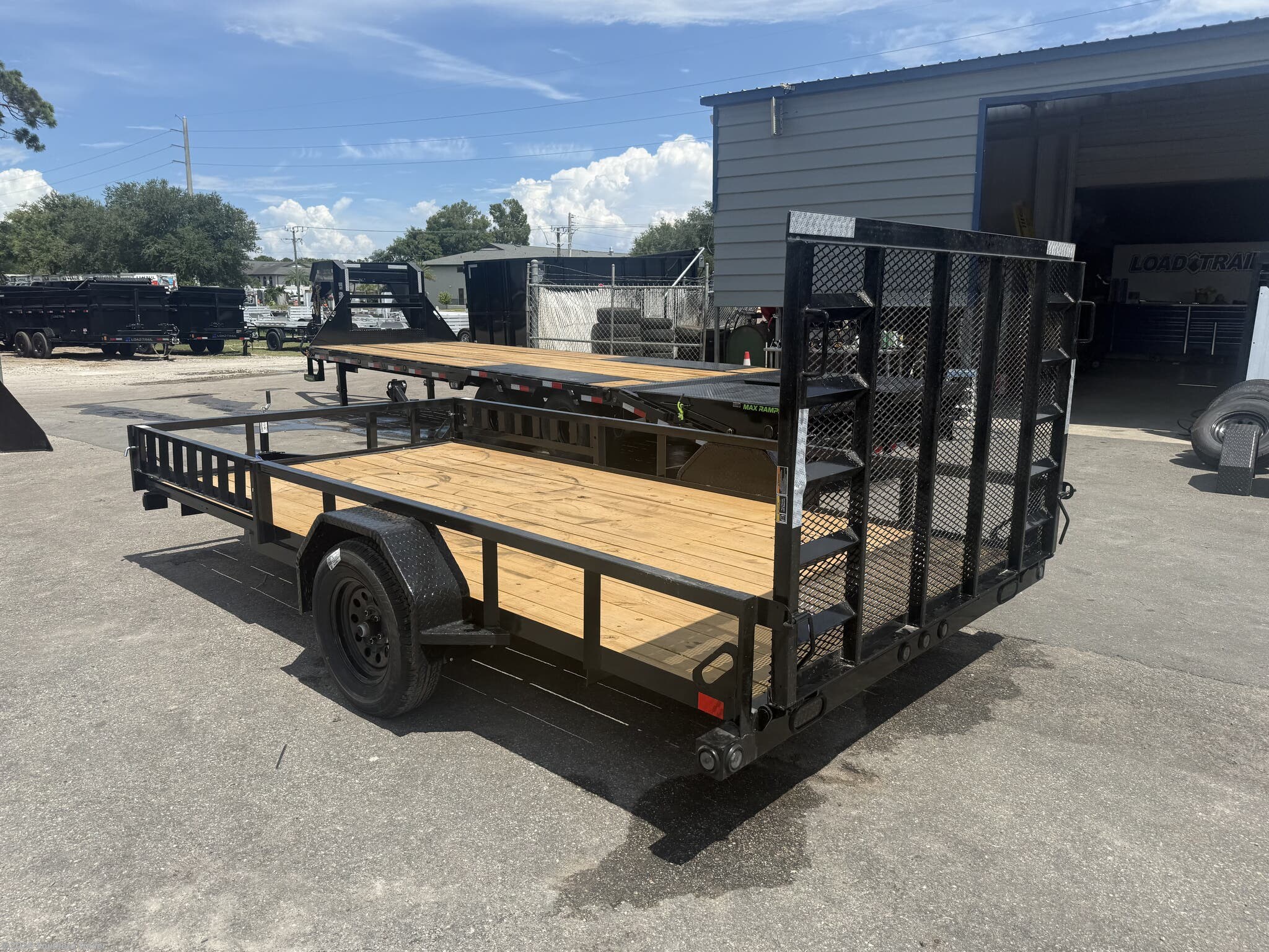 New 2026 Load Trail SE 83X14 Utility Trailer w/Side Rail Ramps 2990 GVWR available in Englewood, Florida