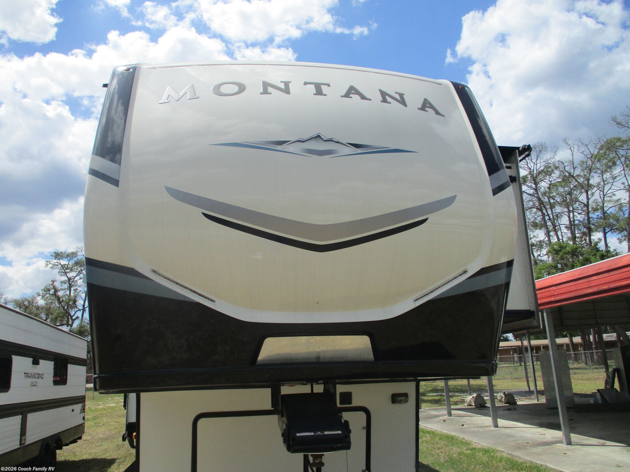 2021 Keystone Montana Legacy 3230CK - Used Fifth Wheel For Sale by Couch Family RV in Cross City, Florida features Refrigerator, Outside Kitchen, Hitch, Heat Pump, Central Vacuum