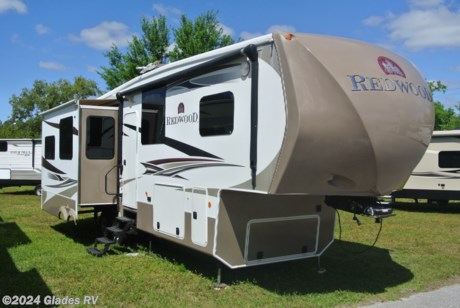 &lt;p&gt;THIS WELL MAINTAINED LUXURY 5TH WHEEL FEATURES 3 SLIDES W/TOPPERS, SIX POINT AUTO LEVEL, ROOF LADDER, 2X2 RECEIVER HITCH, POWER AWNING, ALUMINIUM WHEELS, 2 TVS, FIREPLACE, SOLID SURFACE COUNTER TOPS, CONVECTION/MICROWAVE, RANGE W/OVEN, 4 DOOR REFER W/ICE MAKER, ONE PIECE MOLDED SHOWER W/ SEAT, GLASS SHOWER DOOR, LARGE FRONT WARDROBE AND MUCH MORE!&lt;/p&gt;