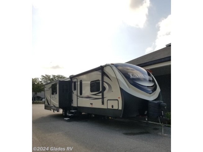 2017 Keystone Laredo 330RL - Used Travel Trailer For Sale by Glades RV in Fort Myers, Florida features Non-Smoking Unit, Power Awning, Outside Kitchen, Leveling Jacks, CO Detector