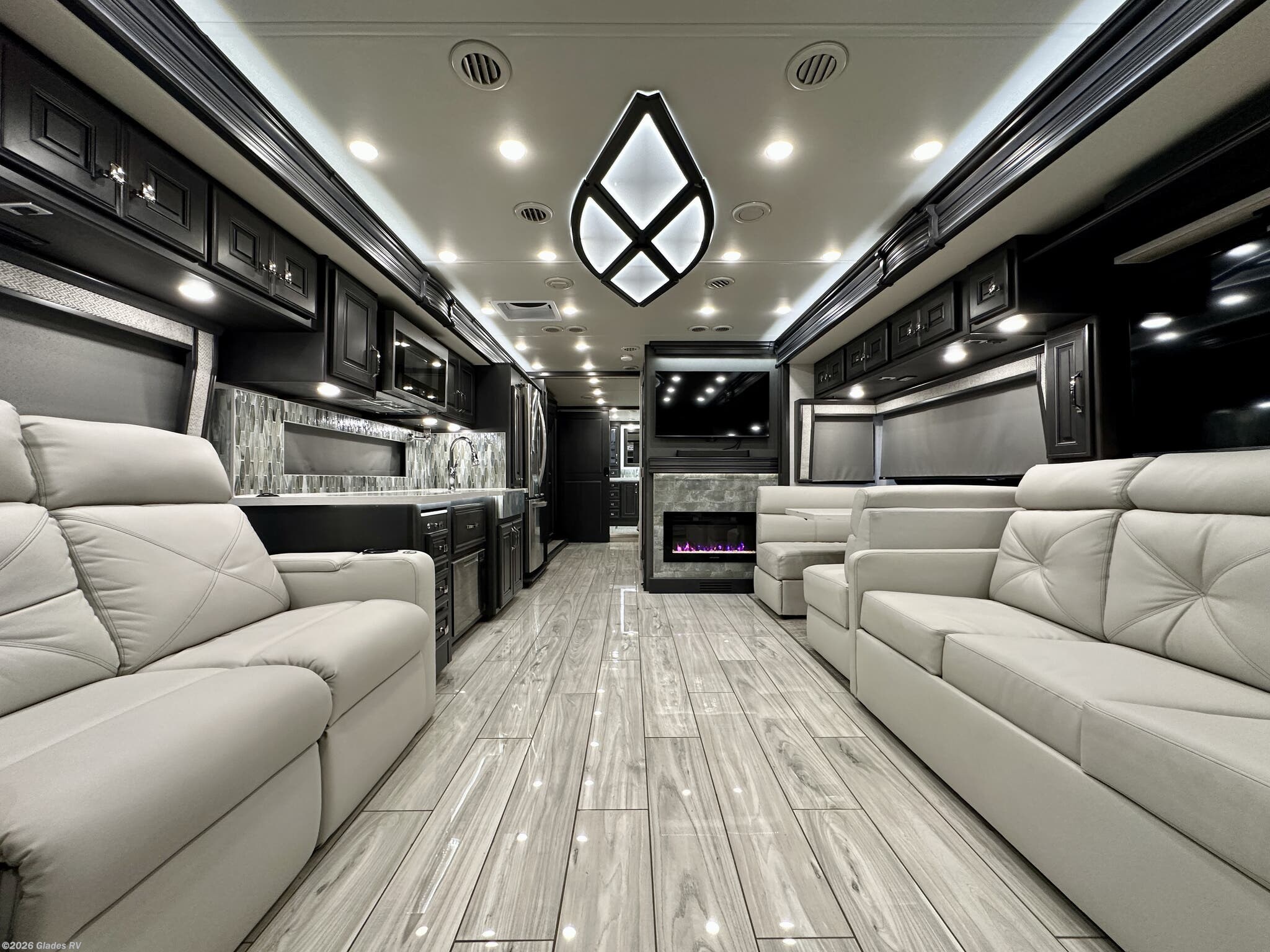 2024 Holiday Rambler Armada 40M - Used Diesel Pusher For Sale by Glades RV in Fort Myers, Florida features Fireplace, King Size Bed, Washer, Televator TV, In-Motion Satellite Dish