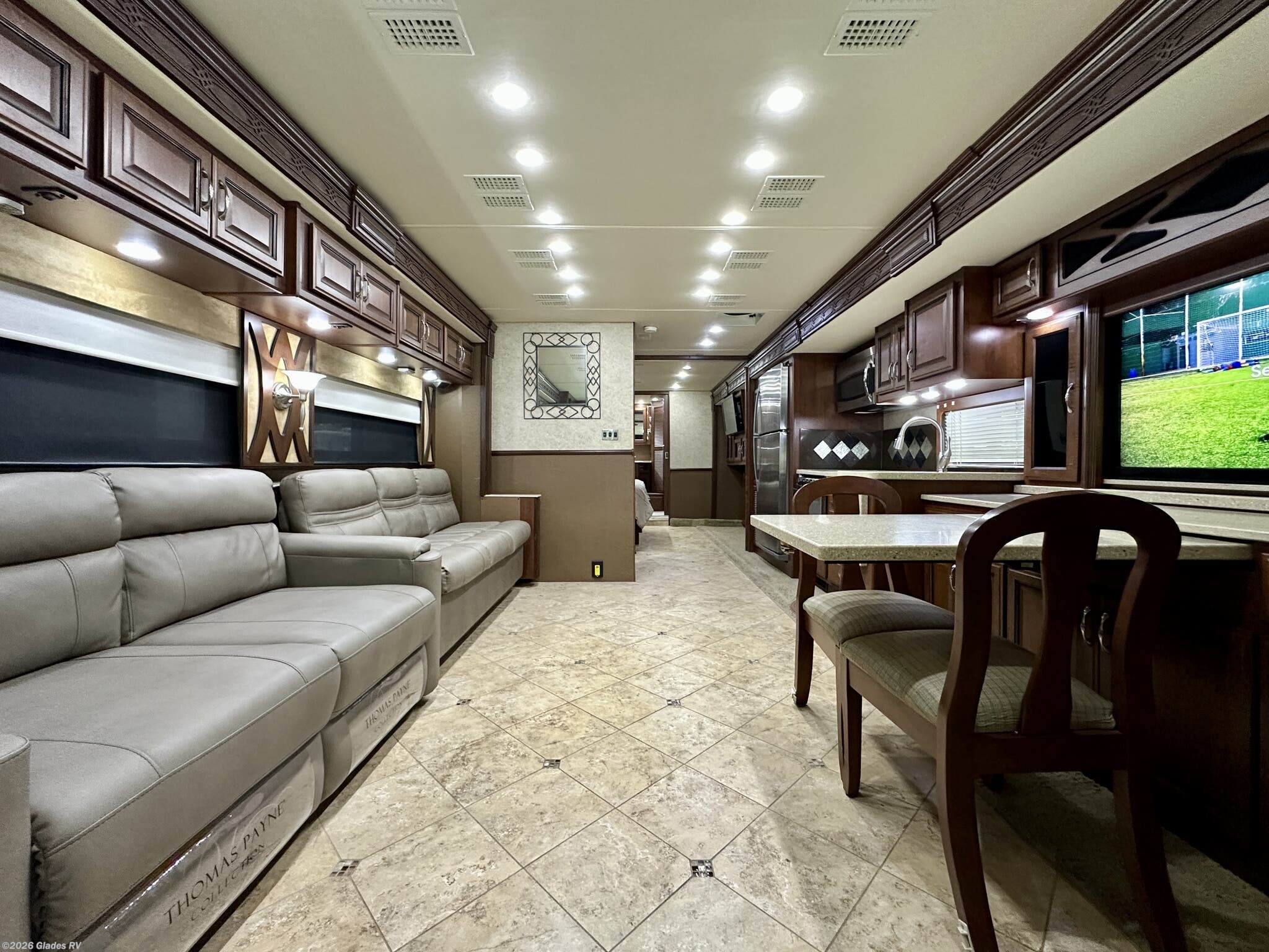 2012 Fleetwood Expedition 38S - Used Diesel Pusher For Sale by Glades RV in Fort Myers, Florida features Washer, Satellite Dish, Backup Camera, Televator TV, King Size Bed