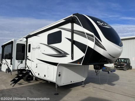 In pursuit of family fun on the road? Look no further than this New 2024 Grand Design Solitude 310GK Fifth Wheel!

Virtual Tour-https://virtualtour.granddesignrv.com/tours/czUxiMzii

Exterior Features:
EXTERIOR
Exterior Spray Port (Door Side)
Front Cap Windshield (380FL, 382WB)
King Jack Antenna
High-Gloss Gel Coat Exterior Sidewalls
Color Matched Fender Skirt
TPO Roof Covering w/ Limited Lifetime Warranty
Slam-Latch Baggage Doors
Magnetic Entry and Baggage Door Catches
Entry Door w/Privacy Glass
Frameless Tinted Windows
Painted Gel Coat Fiberglass Front Cap
Roof Ladder
17.5&quot; Spare Tire (Undermount)
Power Patio Awning with Integrated LED Lighting
Sewer Hose Storage Area
Easy Clean Solid Surface Steps
Keyed Alike
SolidStep Quad Entry Steps
 
CONSTRUCTION
Drop Frame Chassis
Upgraded Axle Hangers
5-Side Aluminum Cage Construction
Walk-On Roof
Fully Enclosed Underbelly w/ Heated Tanks and Storage
 
RUNNING GEAR
Heavy Duty 7,000 lb. Axles
17.5&quot; H-Rated Aluminum Wheels
MORryde CRE3000 Suspension System
ABS Braking System
 
FRAME &amp; CHASSIS
101&quot; Widebody Construction
MORryde Pin Box
Slide-Out Selector Valves

Interior Features:
INTERIOR
Double Tri-Fold Hide-A-Bed Sofas (375RES, 378MBS, 380FL, 382WB, 390RK)
Leaded Glass Cabinet Door Inserts (Select Areas)
Under Step Shoe Storage (Most Models)
Plywood Drawer Bottoms
Premium Roller Shades
Hardwood Window Treatments
Congoleum Flooring w/3-Year Warranty
Hallway Handrail
Hardwood Cabinet Doors
Signature Wall Mounted Dinette Table w/4 Padded Chairs
Theatre Seating
Tri-Fold Hide-A-Bed Sofa
Smoke Detector, LP Alarm, Carbon Monoxide Alarm
 
KITCHEN
Oversized Kitchen Pantry
LED Rope Lighting in Pantry
Residential Kitchen Faucet with Pullout Sprayer
Real Tile Backsplash
Hardwood Kitchen Light Soffit
Dishwasher Prep (280RK, 310GK, 345GK, 372WB, 373FB, 390RK)
Hutch with Flip-Top Hidden Storage (380FL, 382WB, 390RK)
Washer/Dryer Prep
Solid Surface Countertops &amp; Sink Covers
Stainless Steel Undermount Kitchen Sink
 
ELECTRICAL
55 Amp Converter
Under Unit LED Light Kit
Solar Prep (10 gauge wiring with universal MC4 connectors)
Exterior Security Light
50 Amp Service w/ Detachable Power Cord
12-Volt Battery Disconnect
Recessed LED Ceiling Lighting
Interior LED Accent Lighting
 
HVAC
Kitchen 12-Volt High Power MaxxAir Fan with Rain Sensor
Stealth A/C System
35k BTU High Capacity Furnace
Attic Vent
High Capacity Heat Ducts
PLUMBING
On Demand Water Heater
Whole House Water Filtration System
All-In-One Enclosed and Heated Utility Center
 
BEDROOM
Residential Style Headboard
Under Bed Storage Area
Individually Switched Reading Lights Over Bed
60&quot; x 80&quot; Queen Bed
Window Above Master Bed Headboard
Pull-Out Ottoman at Bed Base
Dresser w/ Slide-Top Hidden Storage
Night Stands with USB Ports
Bedside 110-Volt Outlets (2)
 
BATHROOM
One-Piece Fiberglass Shower with Glass Door
Porcelain Toilet
Undermount Lav Sink
 
APPLIANCE
Professional Grade Stainless Steel Cooktop w/ Built-in Oven
Stainless Steel 12 Cu. Ft. 4-Door Refrigerator
Microwave
 
ELECTRONICS
Back-Up Camera Prep
Tire Linc TPMS System
Satellite/Cable Prep
Exterior Cable/Satellite Plug-In
LED Smart TV in Living Area
Rockford Fosgate Stereo Ent. System w/ HDMI and App Controls
Exterior Speakers

Popular Accessories Add-Ons:
Owner&#39;s Kit
Water Filtration System
Exterior Ladder Upgrade
Maxx Air Vent Covers
Backup Cameras
Generators
Much, Much More

Ultimate Transportation in Fargo, ND provides a full line of camper parts and RV accessories along with a full RV service department. A few of these services include winterization, diagnostics, general repair, aftermarket installation, and much more. 

Not seeing the floorplan you&#39;re looking for? We&#39;re happy to work with you to order the custom camper, toy hauler, or ice house that&#39;s right for you. We have a variety of manufacturers such as Grand Design RV, Heartland RV, Forest River XLR Toy Haulers, Ice Castle Rugged RV, and Team Lodge. Check out our showrooms here: https://www.ultimate-transportation.com/recreation/showroom. 
Give us a call at 701-282-6060 or fill out a request form on our website to have our recreational sales team get in contact with you.