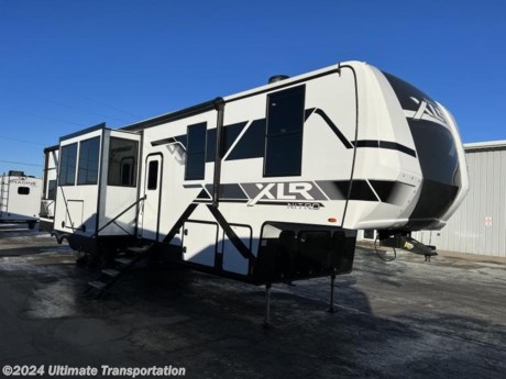 In pursuit of family fun on the road? Look no further than this New 2024 Forest River XLR Nitro 39G15 Toy Hauler! Stock #170819.

Exterior Features:
200 Watt Roof-Mounted Solar Panel &amp; 30 Amp Monitor
Fiberglass Front Cap
Friction Hinge Entry Door(s) w/ Window
Dual 30# LP Tanks
50AMP Service w/ Transfer Switch
Black Tank Flush
Gel-Coated Fiberglass Exterior
Fully-Walkable Roof
Singular Roof Membrane w/ 12 Year Warranty
Vaccum-Bonded Alum. Framed Sidewalls
Laminated &amp; Insulated Slide Room Walls
Fully Enclosed Underbelly w/ Radiant Foil Layer
Electric Awning w/ LED Lights Main &amp; Secondary (N/A 28DK5)
Full-LED Rear Tail Lights
Undercarriage Lighting
MORryde Folding Steps Entry Door
MORryde Saf-T Handle Main entry
Grab Handle Secondary Entry
Square Windows w/ Built in Shades

Chassis
MORryde CRE3000 Suspension Enhancement
Ground Control 3.0 Auto Electric Leveling
16&quot; Goodyear Endurance Tires
Aluminum Wheels
Dexter EZ-Lube Axles
Full-Sized Spare Tire
Nev-R-Adjust Brakes
Heated Tanks

Interior Features:
Contemporary Interior Design
1.5 cu. ft. Microwave
160 Gallons Fresh Water Tank
24&quot; Oven w/ Cast Iron Cooktop
Bathroom Skylight
Lumber Core Cabinet Stiles
Adjustable Hidden Hinge Cabinet Hardware
Full Extension Four-Sided Drawers
Radiant Foil Insulation Technology (Ceiling, Floors)
Waterfall Stainless Sink w/ Cup Washer
15k BTU Main
13.5k BTU Secondary Ducted Air Conditioning Distribution System
Hardwood Cabinet Doors
LED Accent Lighting
Luna Quartz Bathroom Countertops
66X80 Master Bedroom Mattress
72&quot; Solid Core Passage Doors
Master Bedroom Accent Wall
Congoleum Stain-Resistant Vinyl Flooring
Window Trim Package
Diamonds Solid Surface Kitchen Countertop
Electric Fireplace (N/A 28DK5)
1000W Inverter
16 cu. ft. 12 Volt Residential-Style Refrigerator

Specifications:
HITCH WEIGHT
3,105 lb.
UVW
15,089 lb.
CCC
2,911 lb.
EXTERIOR LENGTH
44&#39; 11&quot;
EXTERIOR HEIGHT
TBD
EXTERIOR WIDTH
101&quot;
FRESH WATER
160 gal.
GRAY WATER
100 gal.
BLACK WATER
80 gal.
AWNING SIZE
12&#39; &amp; 20&#39;

Popular Accessories Add-Ons:
Owner&#39;s Kit
Water Filtration System
Exterior Ladder Upgrade
Maxx Air Vent Covers
Backup Cameras
Generators
Much, Much More

Ultimate Transportation in Fargo, ND provides a full line of camper parts and RV accessories along with a full RV service department. A few of these services include winterization, diagnostics, general repair, aftermarket installation, and much more. 

Not seeing the floorplan you&#39;re looking for? We&#39;re happy to work with you to order the custom camper, toy hauler, or ice house that&#39;s right for you. We have a variety of manufacturers such as Grand Design RV, Heartland RV, Forest River XLR Toy Haulers, Ice Castle Rugged RV, and Team Lodge. Check out our showrooms here: https://www.ultimate-transportation.com/recreation/showroom. 
Give us a call at 701-282-6060 or fill out a request form on our website to have our recreational sales team get in contact with you.