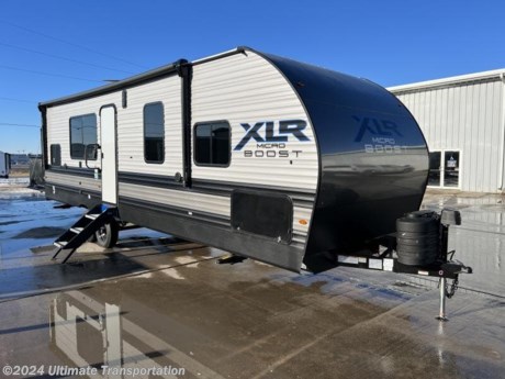 In pursuit of family fun on the road? Look no further than this New 2024 Forest River XLR MicroBoost 2714M Travel Trailer Toy Hauler! Stock #002088.

3D Virtual Tour-https://my.matterport.com/show/?m=XxfQ4LQiFJt

Features-XPLORE PKG-Mandatory 
Manual Euro Garage Bed
Main Entry Upgraded Step
Friction Hinge Entry Door
VIP Patio Deck
Industrial Garage Flooring
Magnetic Screen Wall
Exterior LED Strip Scare Light
LED Interior Lights
Power Awning
30 Amp Service (TT Only)
Docking Station
Skylight Over Tub
Vent Fan Main Bathroom
Ducted A/C
Black Tank Flush
Power Tongue Jack (TT)
TV Hookups w/Backer &amp; Brackets (Living Area, Bedroom, Exterior)
Renewable Energy Package: 200W Solar Panel &amp; 30A Solar Controller Wall Monitor
Residential Stainless Steel Kitchen &amp; Lavy Sinks
Sink Cover/Dish Rack
Residential-Style Kitchen Faucet
Decorative Kitchen Backsplash
Decorative Glass Insert Cabinet Doors (Kitchen)
Tub Surround
USB Charging Station
LP Quick Connect
Black Steel Wheels
Spare Tire
Pet Leash
Rear Beaver Tail Frame
LCI Roof Ladder Prep 
Convenience PKG-Mandatory 
Tankless Water Heater
10 Cu Ft-12VDC Black Refrigerator
17&quot; Oven w/ 3 Burner Cooktop w/ Glass Cover
.9 Microwave
Slim Range Hood Vent
2 Zone-HDMI / BT Radio
2 Interior &amp; 2 Exterior Marine Grade Speakers
30&quot;-5K BTU Fireplace (As model permits)
15K BTU STD Main Roof A/C
Back Up Camera Ready
Digital TV Antenna 
Climate Comfort PKG - Mandatory 
(R7) Freon Rigid Urethane Spray Foam Sidewall and (R11) Freon Rigid Urethane Spray Foam Roof Insulation with Alumifoil Insulation Wrapping 
(R7) Fiberglass Flooring Insulation
Alumifoil Insulated Enclosed Underbelly
Roof Attic Vents

Specifications:
HITCH WEIGHT
1,270 lb.
UVW
7,063 lb.
CCC
4,407 lb.
EXTERIOR LENGTH
32&#39; 5&quot;
EXTERIOR HEIGHT
12&#39; 2&quot;
EXTERIOR WIDTH
101&quot;
FRESH WATER
87 gal.
GRAY WATER
76 gal.
BLACK WATER
38 gal.
AWNING SIZE
18&#39;
Popular Accessories Add-Ons:
Owner&#39;s Kit
Water Filtration System
Exterior Ladder Upgrade
Maxx Air Vent Covers
Backup Cameras
Generators
Much, Much More

Ultimate Transportation in Fargo, ND provides a full line of camper parts and RV accessories along with a full RV service department. A few of these services include winterization, diagnostics, general repair, aftermarket installation, and much more. 

Not seeing the floorplan you&#39;re looking for? We&#39;re happy to work with you to order the custom camper, toy hauler, or ice house that&#39;s right for you. We have a variety of manufacturers such as Grand Design RV, Heartland RV, Forest River XLR Toy Haulers, Ice Castle Rugged RV, and Team Lodge. Check out our showrooms here: https://www.ultimate-transportation.com/recreation/showroom. 
Give us a call at 701-282-6060 or fill out a request form on our website to have our recreational sales team get in contact with you.