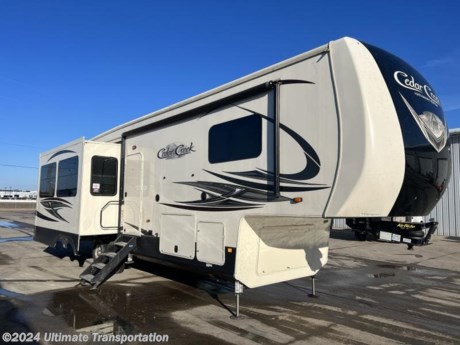 In pursuit of family fun on the road? Look no further than this Used 2020 Forest River Cedar Creek Hathaway Edition Fifth Wheel! Stock #223779.

Popular Accessories Add-Ons:
Owner&#39;s Kit
Water Filtration System
Exterior Ladder Upgrade
Maxx Air Vent Covers
Backup Cameras
Generators
Much, Much More

All used campers &amp; ice houses sold by Ultimate Transportation are sold AS IS with no warranty. Inspections &amp; services are available for additional cost. Used units are priced appropriately knowing the potential for service work needed. 

Ultimate Transportation in Fargo, ND provides a full line of camper parts and RV accessories along with a full RV service department. A few of these services include winterization, diagnostics, general repair, aftermarket installation, and much more. 

Not seeing the floorplan you&#39;re looking for? We&#39;re happy to work with you to order the custom camper, toy hauler, or ice house that&#39;s right for you. We have a variety of manufacturers such as Grand Design RV, Heartland RV, Forest River XLR Toy Haulers, Ice Castle Rugged RV, and Team Lodge. Check out our showrooms here: https://www.ultimate-transportation.com/recreation/showroom. 
Give us a call at 701-282-6060 or fill out a request form on our website to have our recreational sales team get in contact with you.