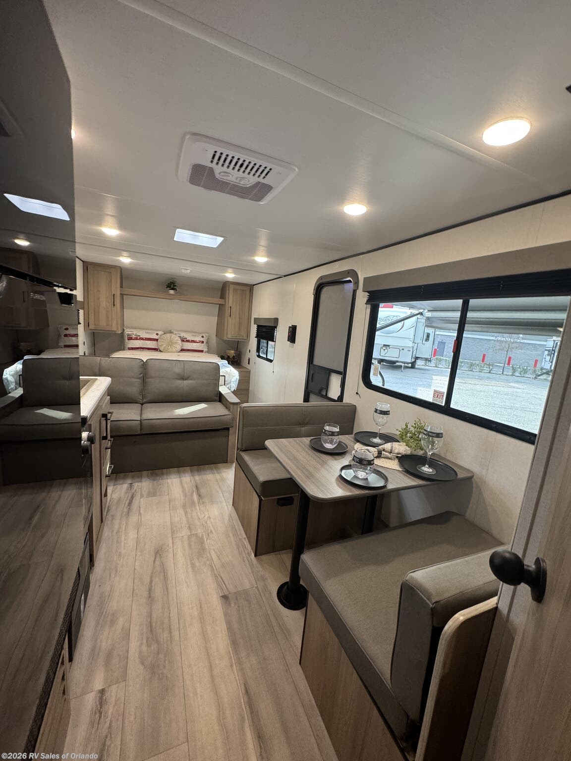 2025 Keystone Coleman 23B - Used Travel Trailer For Sale by RV Sales of Orlando in Longwood, Florida features Power Awning, Backup Camera, Furnace, Refrigerator, Roof Vents