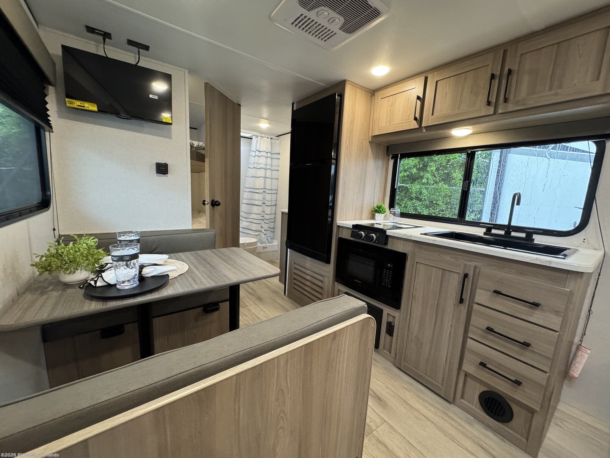 2025 Keystone Coleman 23B - Used Travel Trailer For Sale by RV Sales of Orlando in Longwood, Florida features Shower, Fire Extinguisher, Furnace, Smoke Detector, Water Heater