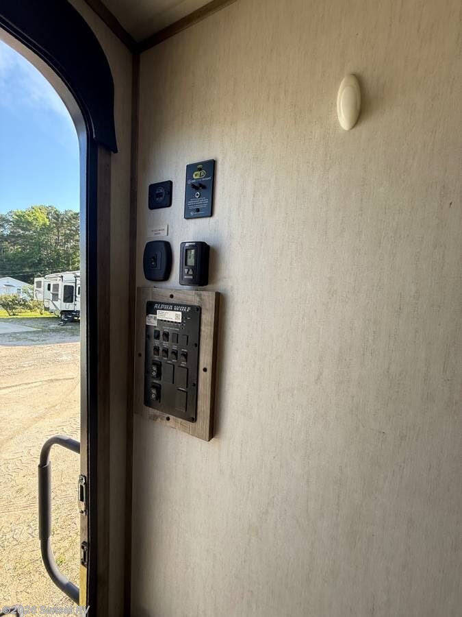 2021 Forest River Cherokee Alpha Wolf 22SW-L - Used Travel Trailer For Sale by Sunset RV in Sunset Beach, North Carolina features Stove Top Burner, Furnace, Microwave, Oven, Skylight