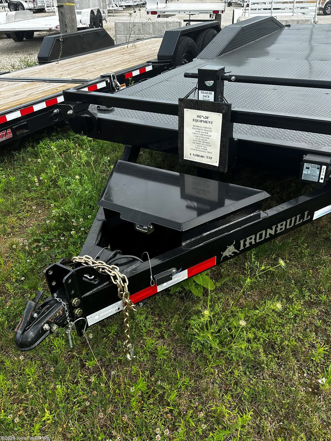IronBull 102" x 20' Utility Trailer, IronBull ETB0220, Driveover Fenders, 14000 lbs GVWR, Powdura Powder Coat, One Cure Primer, 7000 lb axles, 3042 lb dry weight, 10000 lb drop-leg jack, EZ Lube Oil-Bathed Hubs, Radial Tires, 235/80 R16 tires, 20-foot utility trailer, 25-inch deck height, Slide-In Ramps, 18'' x 5' ramps, D-Rings, 3'' D-Rings, Adjustable Coupler, 2 5/16'' coupler, 3-inch Structural Crossmembers, Electric Breakaway Kit, DOT-Approved Lighting, steel frame, steel floor, Driveover fenders, Lifetime LED Lighting warranty, 3-year structural coverage, 2-year component coverage, Free Roadside Assistance, heavy-duty utility trailer, versatile hauling solution, commercial use trailer, personal use trailer, high-performance trailer, durable trailer, reliable trailer, trailer for heavy equipment, trailer for vehicles, trailer dealer, trailer manufacturer, trailer financing, trailer specials, utility trailer for sale, new utility trailer, high-quality utility trailer, trailer review