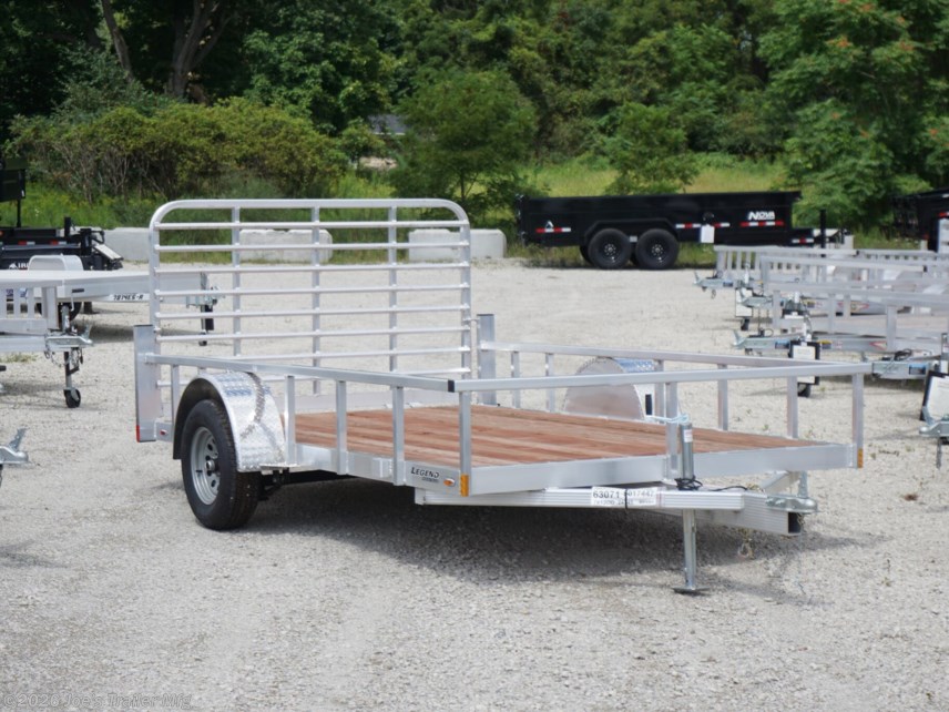 Legend 7x12 Open Deluxe Utility Trailer, 17" deck height utility trailer, 48" ramp gate trailer, 3.5k EZ-Lube spring axle, ST205/75R14 Silver Mod steel tires, 3" tube cross members, 24" on center cross member spacing, 4" tube frame trailer, aluminum flooring utility trailer, LED lighting trailer, 2" straight coupler, 2k top-wind jack, ATP fenders, stake pockets, aluminum utility trailer, open deluxe trailer, Legend utility trailer, lightweight utility trailer, durable trailer frame, trailer with LED lights, easy-to-lube axle, high-quality utility trailer, trailer with ramp gate, spring axle utility trailer, Legend trailer features, utility trailer with aluminum flooring, adjustable coupler trailer, top-wind jack utility trailer, trailer with ATP fenders, customizable utility trailer, Legend open trailer, utility trailer for heavy loads, trailer for equipment transport, low-profile utility trailer, trailer with stake pockets, utility trailer for landscaping, 12' utility trailer, trailer Legend 7x12 Open Deluxe Utility Trailer, 17" deck height utility trailer, 48" ramp gate trailer, 3.5k EZ-Lube spring axle, ST205/75R14 Silver Mod steel tires, 3" tube cross members, 24" on center cross member spacing, 4" tube frame trailer, aluminum flooring utility trailer, LED lighting trailer, 2" straight coupler, 2k top-wind jack, ATP fenders, stake pockets, aluminum utility trailer, open deluxe trailer, Legend utility trailer, lightweight utility trailer, durable trailer frame, trailer with LED lights, easy-to-lube axle, high-quality utility trailer, trailer with ramp gate, spring axle utility trailer, Legend trailer features, utility trailer with aluminum flooring, adjustable coupler trailer, top-wind jack utility trailer, trailer with ATP fenders, customizable utility trailer, Legend open trailer, utility trailer for heavy loads, trailer for equipment transport, low-profile utility trailer, trailer with stake pockets, utility trailer for landscaping, 12' utility trailer, trailer