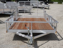 Legend 7x12 Open Deluxe Utility Trailer, 17" deck height utility trailer, 48" ramp gate trailer, 3.5k EZ-Lube spring axle, ST205/75R14 Silver Mod steel tires, 3" tube cross members, 24" on center cross member spacing, 4" tube frame trailer, aluminum flooring utility trailer, LED lighting trailer, 2" straight coupler, 2k top-wind jack, ATP fenders, stake pockets, aluminum utility trailer, open deluxe trailer, Legend utility trailer, lightweight utility trailer, durable trailer frame, trailer with LED lights, easy-to-lube axle, high-quality utility trailer, trailer with ramp gate, spring axle utility trailer, Legend trailer features, utility trailer with aluminum flooring, adjustable coupler trailer, top-wind jack utility trailer, trailer with ATP fenders, customizable utility trailer, Legend open trailer, utility trailer for heavy loads, trailer for equipment transport, low-profile utility trailer, trailer with stake pockets, utility trailer for landscaping, 12' utility trailer, trailer Legend 7x12 Open Deluxe Utility Trailer, 17" deck height utility trailer, 48" ramp gate trailer, 3.5k EZ-Lube spring axle, ST205/75R14 Silver Mod steel tires, 3" tube cross members, 24" on center cross member spacing, 4" tube frame trailer, aluminum flooring utility trailer, LED lighting trailer, 2" straight coupler, 2k top-wind jack, ATP fenders, stake pockets, aluminum utility trailer, open deluxe trailer, Legend utility trailer, lightweight utility trailer, durable trailer frame, trailer with LED lights, easy-to-lube axle, high-quality utility trailer, trailer with ramp gate, spring axle utility trailer, Legend trailer features, utility trailer with aluminum flooring, adjustable coupler trailer, top-wind jack utility trailer, trailer with ATP fenders, customizable utility trailer, Legend open trailer, utility trailer for heavy loads, trailer for equipment transport, low-profile utility trailer, trailer with stake pockets, utility trailer for landscaping, 12' utility trailer, trailer