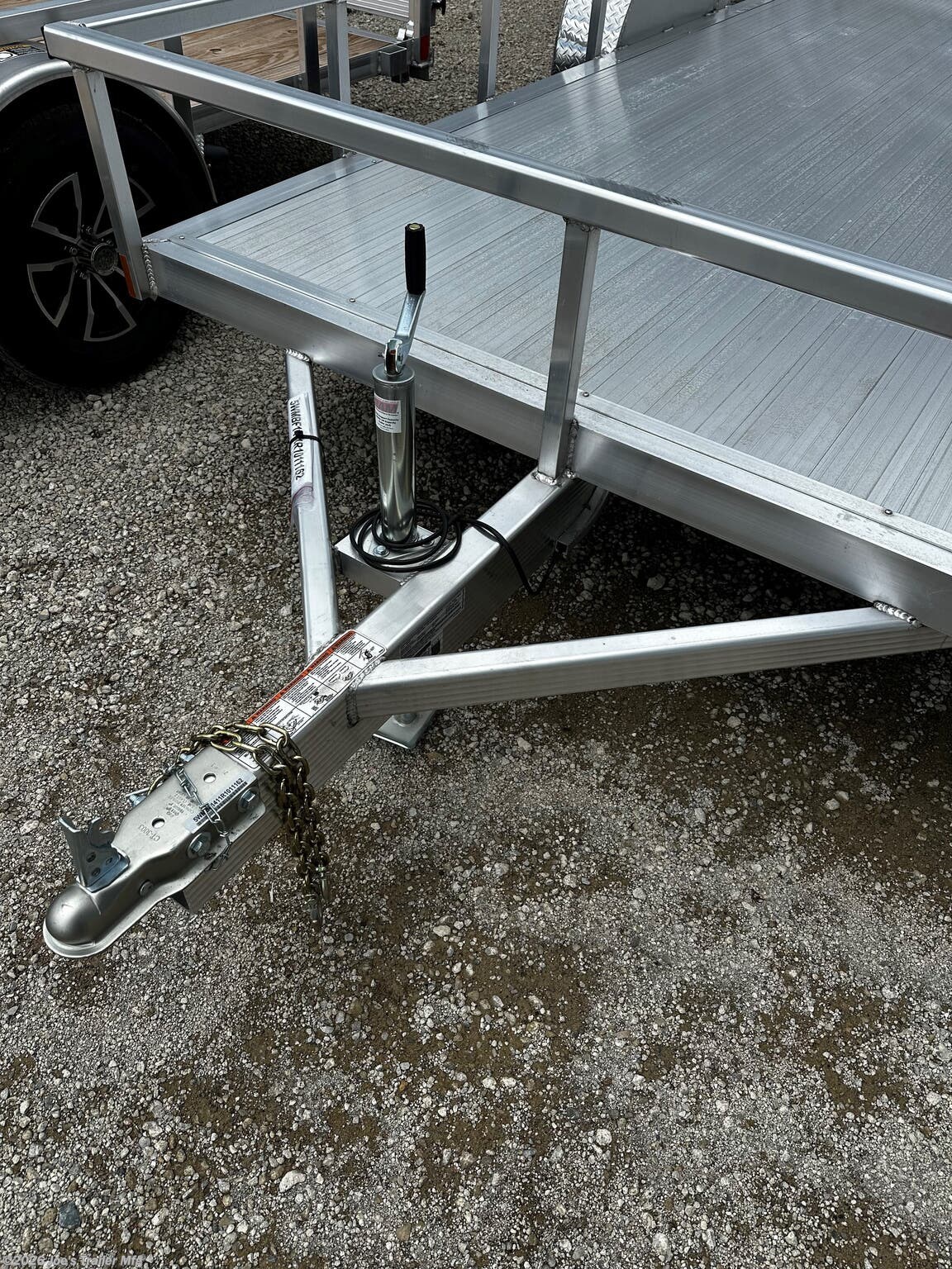 Legend - Tandem Axle: Open Deluxe Aluminum Trailer (5,000 lb GVWR), 3'' x 6'' Extruded Aluminum Triple Tongue Design, ATP Fenders w/ Gussets, Surface Mount LED Lighting, Pressure Treated Decking, Fold-In Radius Gate, Stake Pockets, 2'' x 4'' Tube Rear Gate Supports, Cross Members: 2'' x 3'' Tube 24'' OC, Frame: 2'' x 4'' Perimeter Tube, Jack: 2,000 lb Top-Wind Set Back Jack w/ Foot, Rear Loading: 48'' Fold-In Radius Tube Gate, Sides: 1.5'' x 1.5'' Tube 15'' Tall, Tongue: 3'' x 6'' Extruded Aluminum Triple Tongue, Top Rail: 2'' x 2'' Tube, Axles: 3,500 lb E-Z Lube 4'' Drop Spring 1 Electric Brake & 1 Idler, Tires/Wheels: ST205/75R14 Nitrogen Filled Silver Mod Steel, Floor: Dura Color Radius Edge Deck, 2'' Straight Coupler, Legend 7X14 Aluminum Bi-Fold Trailer, 4" Tube Main Frame, 24" OC Crossmembers, 15" Side Rails, 3.5K Tandem Axle, 2" Coupler, ST205/75R14 Tires, 2K Tongue Jack, Aluminum Flooring, (4) Stake Pockets