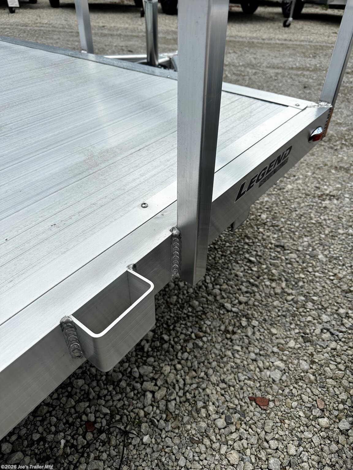 Legend - Tandem Axle: Open Deluxe Aluminum Trailer (5,000 lb GVWR), 3'' x 6'' Extruded Aluminum Triple Tongue Design, ATP Fenders w/ Gussets, Surface Mount LED Lighting, Pressure Treated Decking, Fold-In Radius Gate, Stake Pockets, 2'' x 4'' Tube Rear Gate Supports, Cross Members: 2'' x 3'' Tube 24'' OC, Frame: 2'' x 4'' Perimeter Tube, Jack: 2,000 lb Top-Wind Set Back Jack w/ Foot, Rear Loading: 48'' Fold-In Radius Tube Gate, Sides: 1.5'' x 1.5'' Tube 15'' Tall, Tongue: 3'' x 6'' Extruded Aluminum Triple Tongue, Top Rail: 2'' x 2'' Tube, Axles: 3,500 lb E-Z Lube 4'' Drop Spring 1 Electric Brake & 1 Idler, Tires/Wheels: ST205/75R14 Nitrogen Filled Silver Mod Steel, Floor: Dura Color Radius Edge Deck, 2'' Straight Coupler, Legend 7X14 Aluminum Bi-Fold Trailer, 4" Tube Main Frame, 24" OC Crossmembers, 15" Side Rails, 3.5K Tandem Axle, 2" Coupler, ST205/75R14 Tires, 2K Tongue Jack, Aluminum Flooring, (4) Stake Pockets