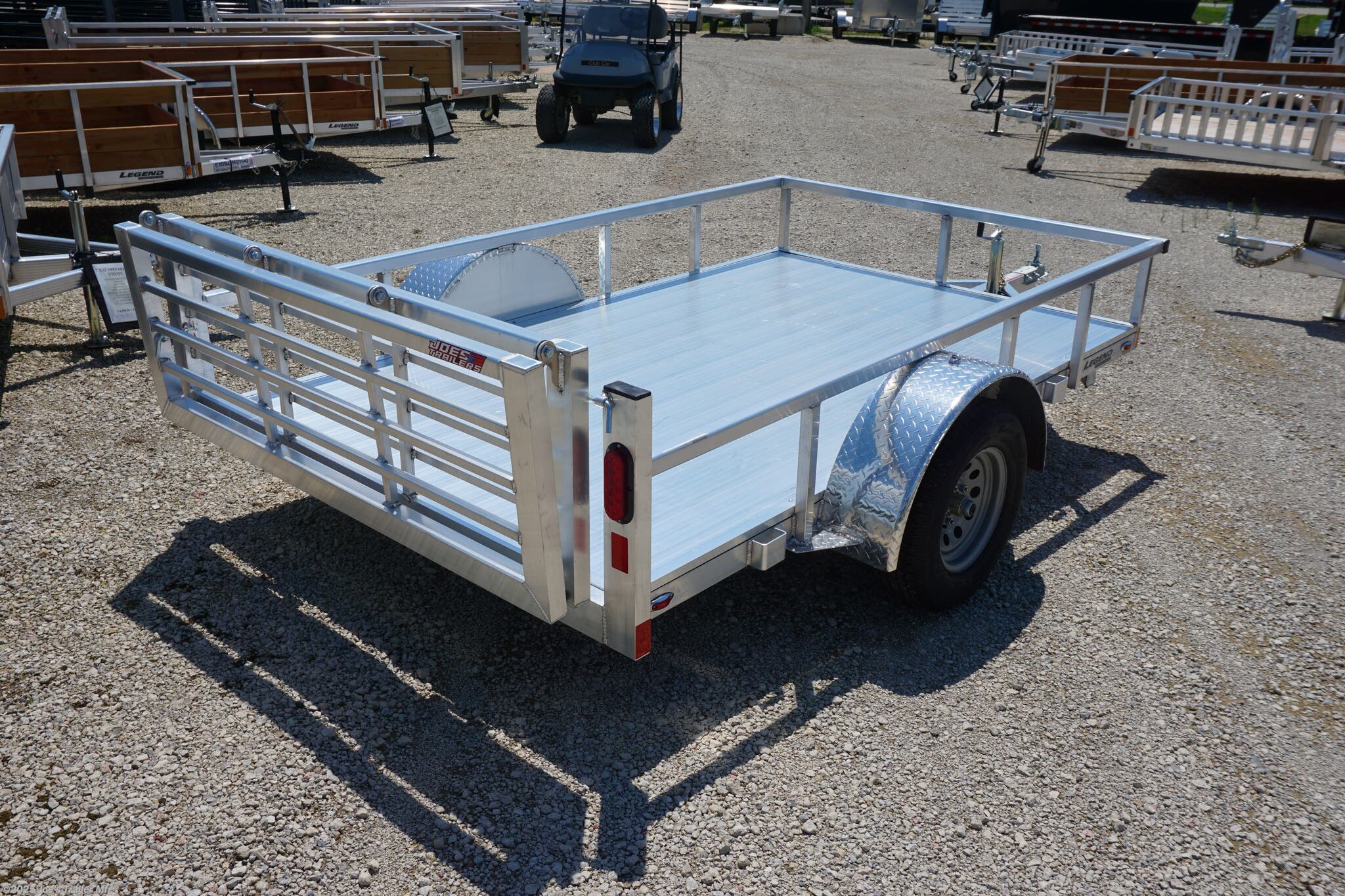 6x10 ODSA, 16" Deck Height, Bi Fold Gate, 3k EZ-Lube Axle, ST20575R14 Silver Mod Steel Tires, 3" Cross Member, 24" On Center Cross Member, 3" Angle Frame, Aluminum Decking, Led Lighting, 2" A-Frame Coupler, 2k Top-Wind Jack, ATP Fenders, Load Angle, Ramp Length, Load Angle 18°, Ramp Length 48", Ramp Pivot Point, Trailer Specifications, Utility Trailer, Flatbed Trailer, Utility Trailer with Bi Fold Gate, Trailer with EZ-Lube Axle, Trailer with Silver Mod Steel Tires, Trailer with Cross Members, Trailer with Angle Frame, Trailer with Aluminum Decking, Trailer with LED Lighting, Trailer with A-Frame Coupler, Trailer with Top-Wind Jack, Trailer with ATP Fenders, Low Deck Height Trailer, Easy Loading Trailer, Trailer with Durable Frame, Trailer with Heavy Duty Axle, Trailer with Silver Tires, Trailer with Adjustable Ramp, High Quality Utility Trailer, Utility Trailer Features, Heavy Duty Utility Trailer, Utility Trailer Dimensions, Utility Trailer Load Angle, Utility Trailer Ramp Length, Ut