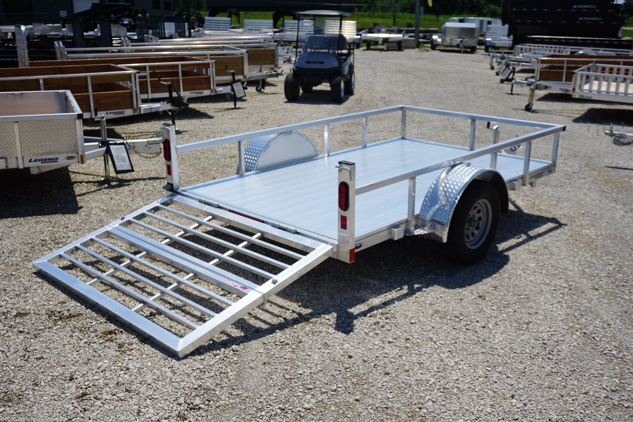 6x10 ODSA, 16" Deck Height, Bi Fold Gate, 3k EZ-Lube Axle, ST20575R14 Silver Mod Steel Tires, 3" Cross Member, 24" On Center Cross Member, 3" Angle Frame, Aluminum Decking, Led Lighting, 2" A-Frame Coupler, 2k Top-Wind Jack, ATP Fenders, Load Angle, Ramp Length, Load Angle 18°, Ramp Length 48", Ramp Pivot Point, Trailer Specifications, Utility Trailer, Flatbed Trailer, Utility Trailer with Bi Fold Gate, Trailer with EZ-Lube Axle, Trailer with Silver Mod Steel Tires, Trailer with Cross Members, Trailer with Angle Frame, Trailer with Aluminum Decking, Trailer with LED Lighting, Trailer with A-Frame Coupler, Trailer with Top-Wind Jack, Trailer with ATP Fenders, Low Deck Height Trailer, Easy Loading Trailer, Trailer with Durable Frame, Trailer with Heavy Duty Axle, Trailer with Silver Tires, Trailer with Adjustable Ramp, High Quality Utility Trailer, Utility Trailer Features, Heavy Duty Utility Trailer, Utility Trailer Dimensions, Utility Trailer Load Angle, Utility Trailer Ramp Length, Ut