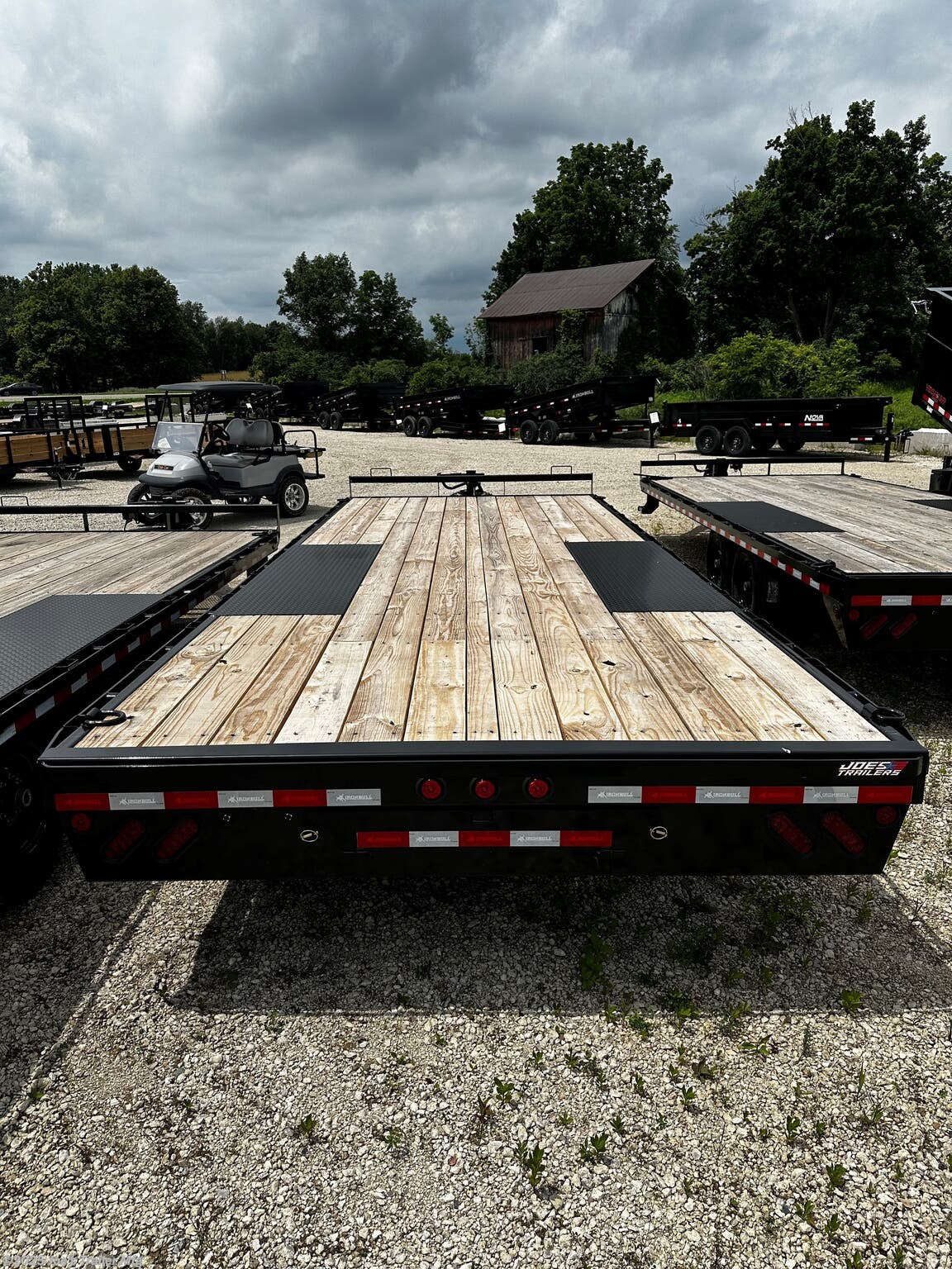 Legend - Tandem Axle: FDP 102 x 22, 10” I-Beam Frame and Tongue, 2 5/16” Adjustable Coupler, 16” Structural Crossmembers, Deck Height 33”, Rub Rail, Stake Pockets & Pipe Spools, Cambered Spring Axles, Multi-leaf Slipper Spring Suspension, E-Z Lube Hubs, 2 Electric Brake Axles, Full 102’ Wide Deckover, Slide in Ramps, 10k Drop-Leg Jack, Treated Pine 2x8 Floor, 4 Standard 3” D-Rings, 235/80R16 Radial Tires with 8 Hole Wheel, Lifetime LED Lighting, All Lighting DOT Approved, Molded Sealed Harness with Resistors, 7-Way Receiver Female Plug with Adapter