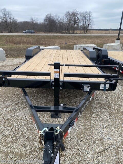 Ironbull ETB8324 Equipment Trailer, 8'' Channel Tongue, 8'' Channel Frame, 2 5/16" Adjustable Coupler, 3" Channel Crossmembers, 2.5 x 2.5 Front Bumper Rail, Rub Rail, Stake Pockets, Removable Diamond Plate Fenders, Cambered Brake Axles, Brakes Equipped, Multi-leaf Slipper Spring Suspension, E-Z Lube Hubs, 2 Electric Brake Axles, 18" x 5' Slide-in Ramps, 10k Drop-Leg Jack, 7k Drop-Leg Jack, 5,500 lb Axles, Treated Pine Floor, 2" x 8" Floor, 4 Standard 3" D-Rings, Radial Tires, Lifetime LED Lighting, DOT Approved Lighting, Molded Sealed Harness, Resistor Wiring Harness, 7-Way Receiver Female Plug, 7-Way Plug Adapter, Powdura Powder Coat, Load Angle 26°, Ramp Length 61 Inches, Heavy-Duty Equipment Trailer, Adjustable Coupler Trailer, Trailer with Diamond Plate Fenders, Multi-leaf Suspension Trailer, E-Z Lube Hubs Trailer, Slide-in Ramps, Drop-Leg Jack, Durable Trailer Floor, Standard D-Rings, LED Trailer Lights, Powder Coated Trailer, Equipment Hauler, Utility Trailer with Brakes, Trailer