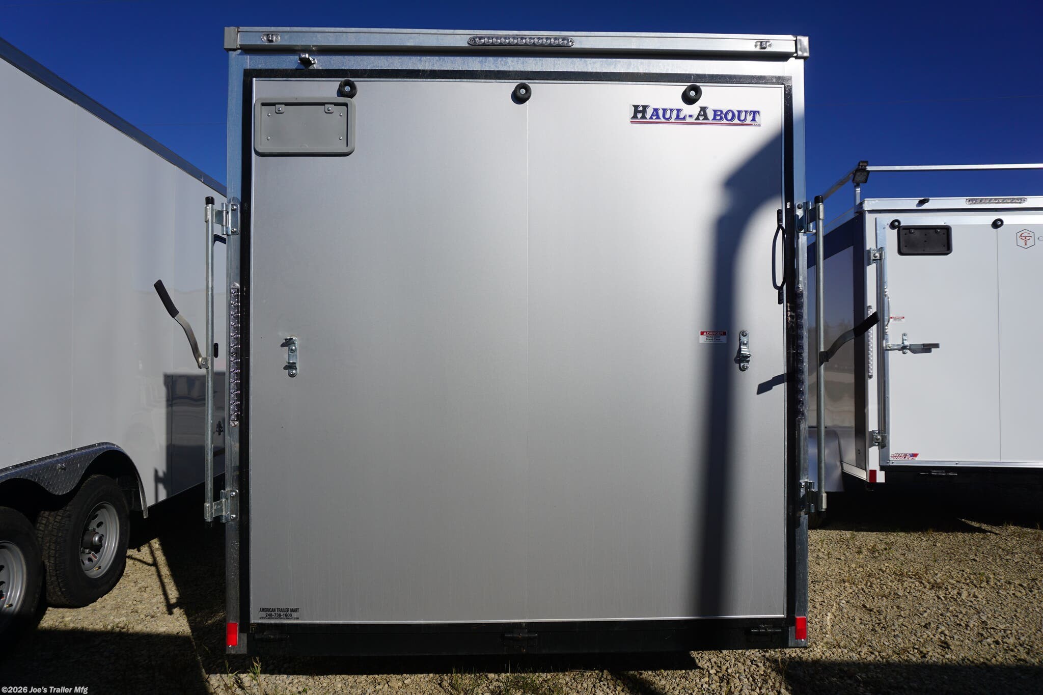 HAUL-ABOUT 84” x 14’ enclosed trailer, HAUL-ABOUT CGR714TA2, 7,000 # GVWR trailer, 4,861 # payload capacity trailer, 2,139 # curb weight, V-front nose trailer, trailer with additional 6” height, trailer with scoop vents, 2 scoop vents trailer, recessed 2K# D-rings, 4 D-rings in trailer, dome lights with switch trailer, upgraded 3/8” plywood trailer, heavy-duty enclosed trailer, enclosed trailer for heavy loads, durable trailer with V-front, custom height trailer, secure tie-down rings in trailer, recessed D-rings for cargo security, LED dome lights trailer, plywood interior trailer, trailer for transporting heavy loads, trailer with additional cargo space, versatile enclosed trailer, trailer with enhanced ventilation, Haul-About enclosed trailer, upgraded plywood Haul-About trailer, trailer with enhanced safety features, cargo trailer with upgraded lighting.