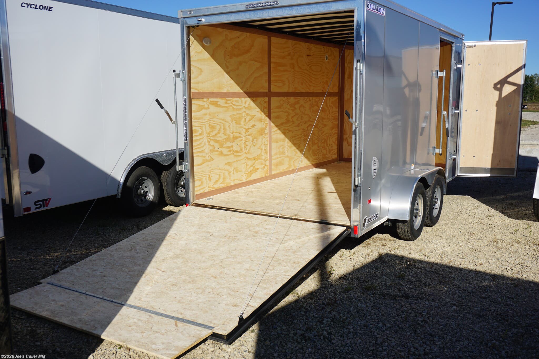 HAUL-ABOUT 84” x 14’ enclosed trailer, HAUL-ABOUT CGR714TA2, 7,000 # GVWR trailer, 4,861 # payload capacity trailer, 2,139 # curb weight, V-front nose trailer, trailer with additional 6” height, trailer with scoop vents, 2 scoop vents trailer, recessed 2K# D-rings, 4 D-rings in trailer, dome lights with switch trailer, upgraded 3/8” plywood trailer, heavy-duty enclosed trailer, enclosed trailer for heavy loads, durable trailer with V-front, custom height trailer, secure tie-down rings in trailer, recessed D-rings for cargo security, LED dome lights trailer, plywood interior trailer, trailer for transporting heavy loads, trailer with additional cargo space, versatile enclosed trailer, trailer with enhanced ventilation, Haul-About enclosed trailer, upgraded plywood Haul-About trailer, trailer with enhanced safety features, cargo trailer with upgraded lighting.