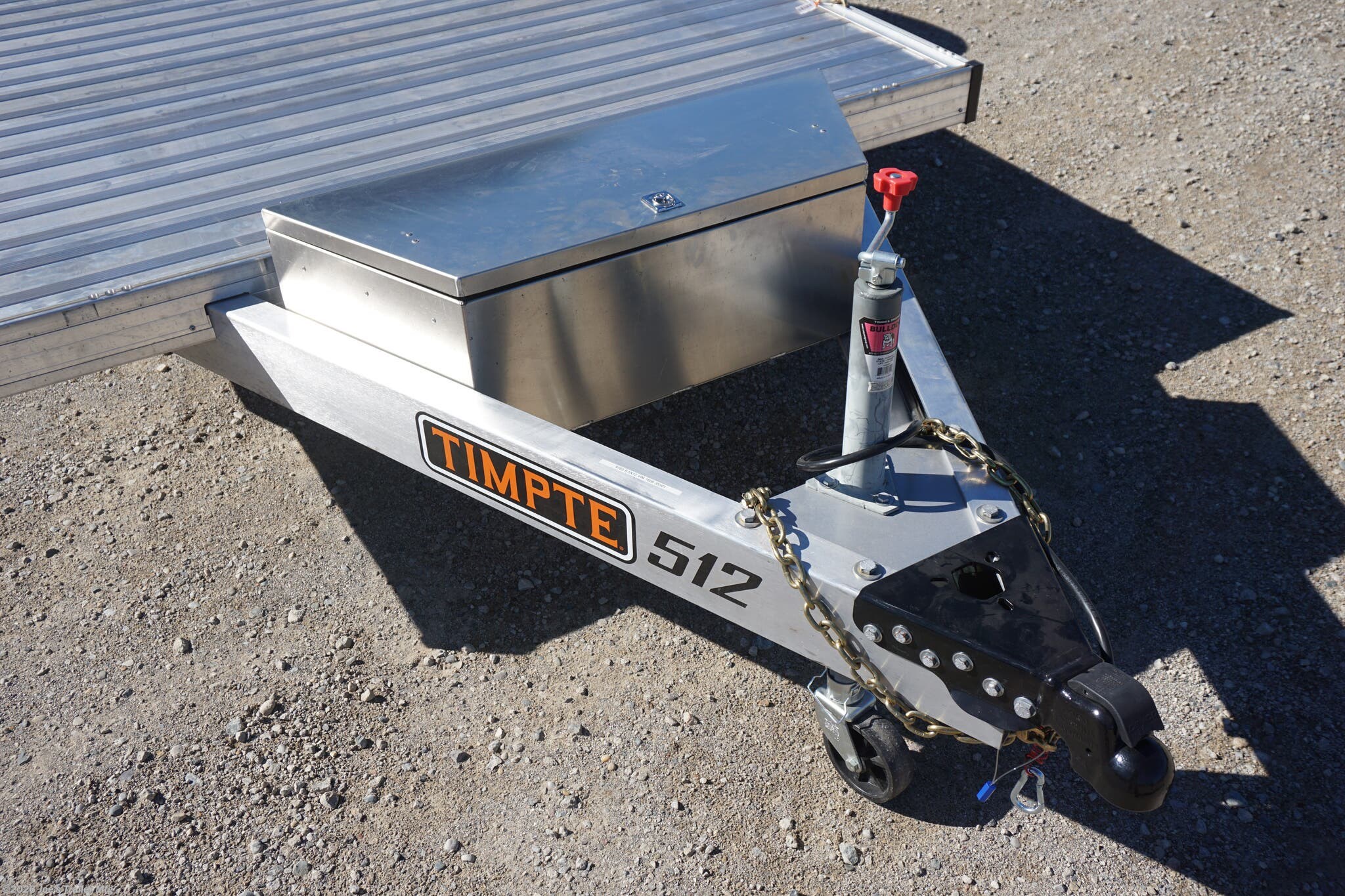 2024 Timpte 0512TSEZ Utility Trailer, Timpte trailers, utility trailer specifications, 5,000 lbs GVWR trailer, heavy-duty trailer, EZ Loader Drop Deck System, wireless remote trailer, vehicle hauling trailer, equipment transport trailer, material transport trailer, durable utility trailer, trailer with torsion axle, trailer with electric self-adjusting brakes, radial tire trailer, ST225/75R15 radial tires, full LED lighting trailer, Wilmington NC trailer, new utility trailer for sale, 144-inch trailer length, 75-inch trailer width, 2,000 lbs top wind jack, 2 5/16" coupler trailer, bumper pull hitch type, trailer with 4 D rings, high-quality material trailer, weather-resistant trailer, trailer with precision engineering, Wilmington trailer dealer, 2024 trailer models, GVWR trailer, one axle trailer, utility trailer with wireless remote, reliable hauling trailer, best trailer for heavy loads, Timpte 2024 trailer lineup, self-adjusting brakes trailer, trailer with full LED package, Wilmin