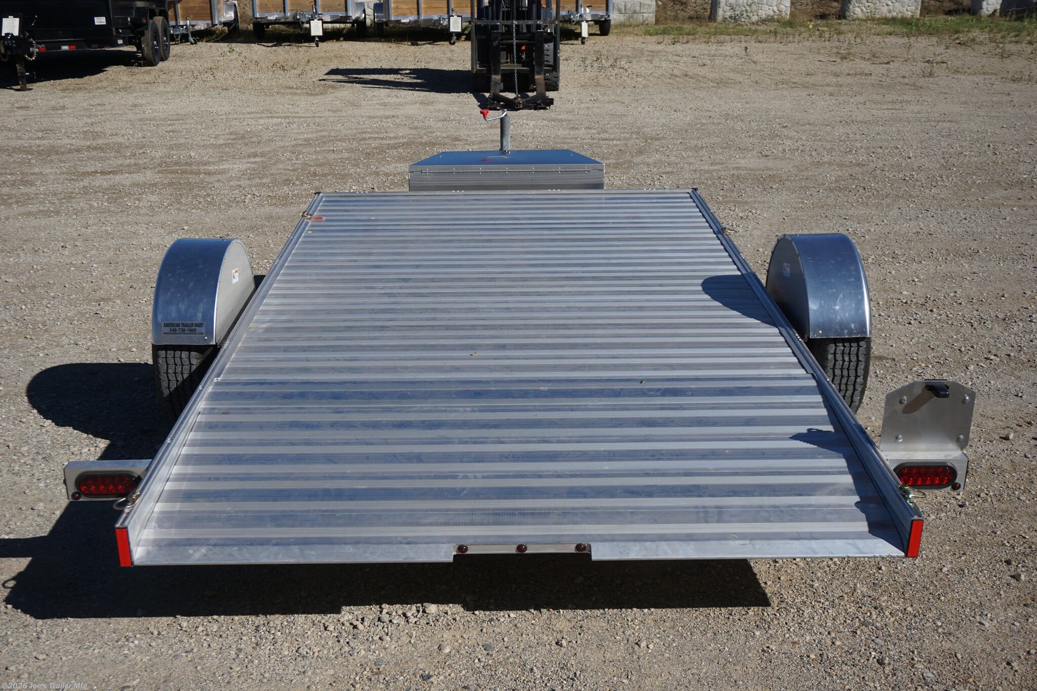 2024 Timpte 0512TSEZ Utility Trailer, Timpte trailers, utility trailer specifications, 5,000 lbs GVWR trailer, heavy-duty trailer, EZ Loader Drop Deck System, wireless remote trailer, vehicle hauling trailer, equipment transport trailer, material transport trailer, durable utility trailer, trailer with torsion axle, trailer with electric self-adjusting brakes, radial tire trailer, ST225/75R15 radial tires, full LED lighting trailer, Wilmington NC trailer, new utility trailer for sale, 144-inch trailer length, 75-inch trailer width, 2,000 lbs top wind jack, 2 5/16" coupler trailer, bumper pull hitch type, trailer with 4 D rings, high-quality material trailer, weather-resistant trailer, trailer with precision engineering, Wilmington trailer dealer, 2024 trailer models, GVWR trailer, one axle trailer, utility trailer with wireless remote, reliable hauling trailer, best trailer for heavy loads, Timpte 2024 trailer lineup, self-adjusting brakes trailer, trailer with full LED package, Wilmin