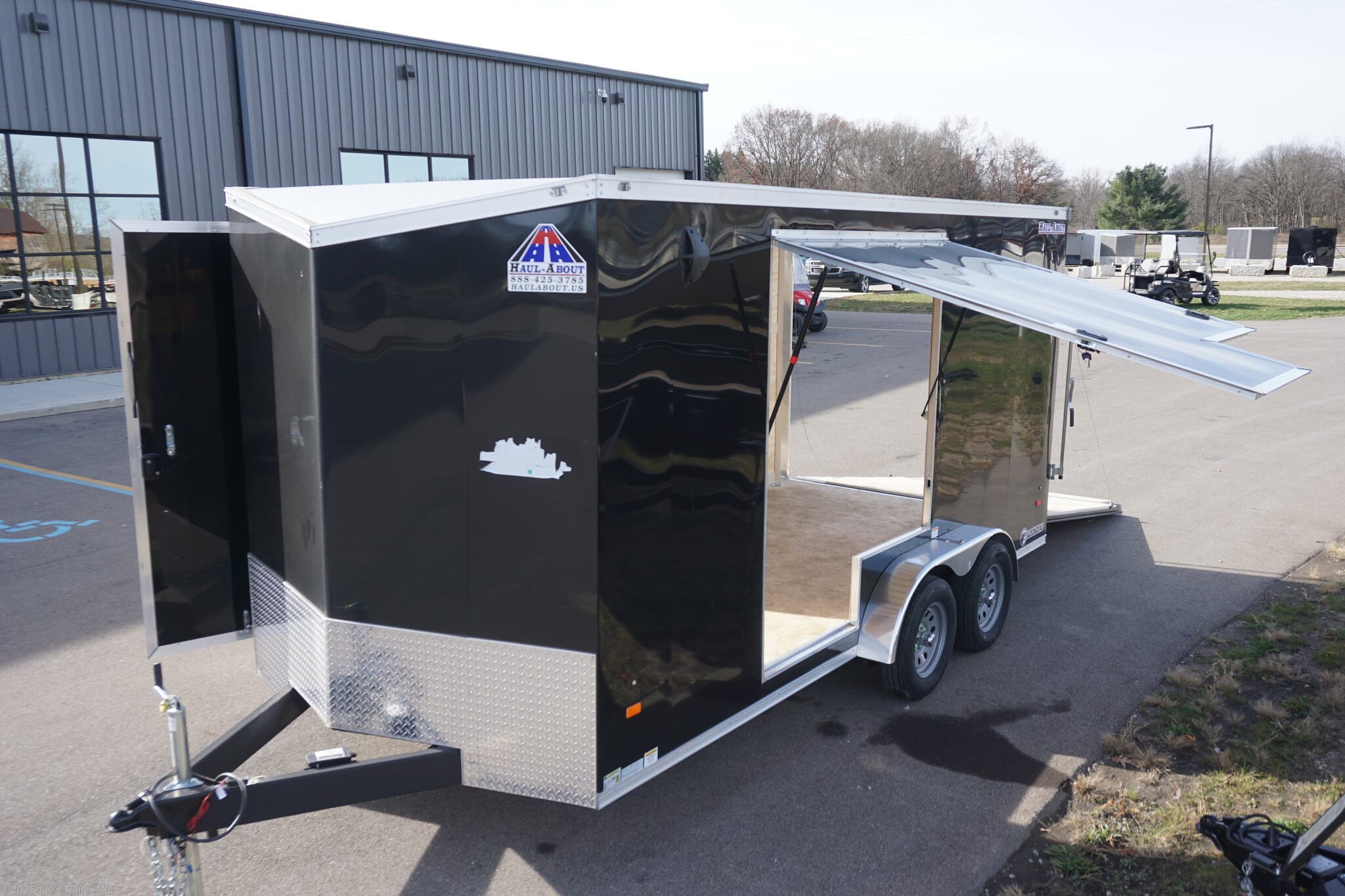 Haul-About 75” x 16’ enclosed trailer, 75” x 16’ trailer, Haul-About aluminum enclosed trailer, dual axle trailer, 2 x 3,500 lb axle trailer, aluminum cargo trailer, bumper pull enclosed trailer, black enclosed trailer, ST205/75R15 trailer tires, 15-inch trailer rims, electric brake trailer, 7,000 lb GVWR trailer, 4,314 lb payload trailer, 2,686 lb curb weight trailer, 75” wide trailer, 16’ long trailer, LED trailer lights, outside LED light with side door switch, 2,000 lb capacity D-rings, recessed floor D-rings, trailer with recessed D-rings, scoop vents trailer, trailer with flush lock, bar lock and flush lock, trailer with flip-up door, UTV trailer, enclosed UTV trailer, trailer for UTV